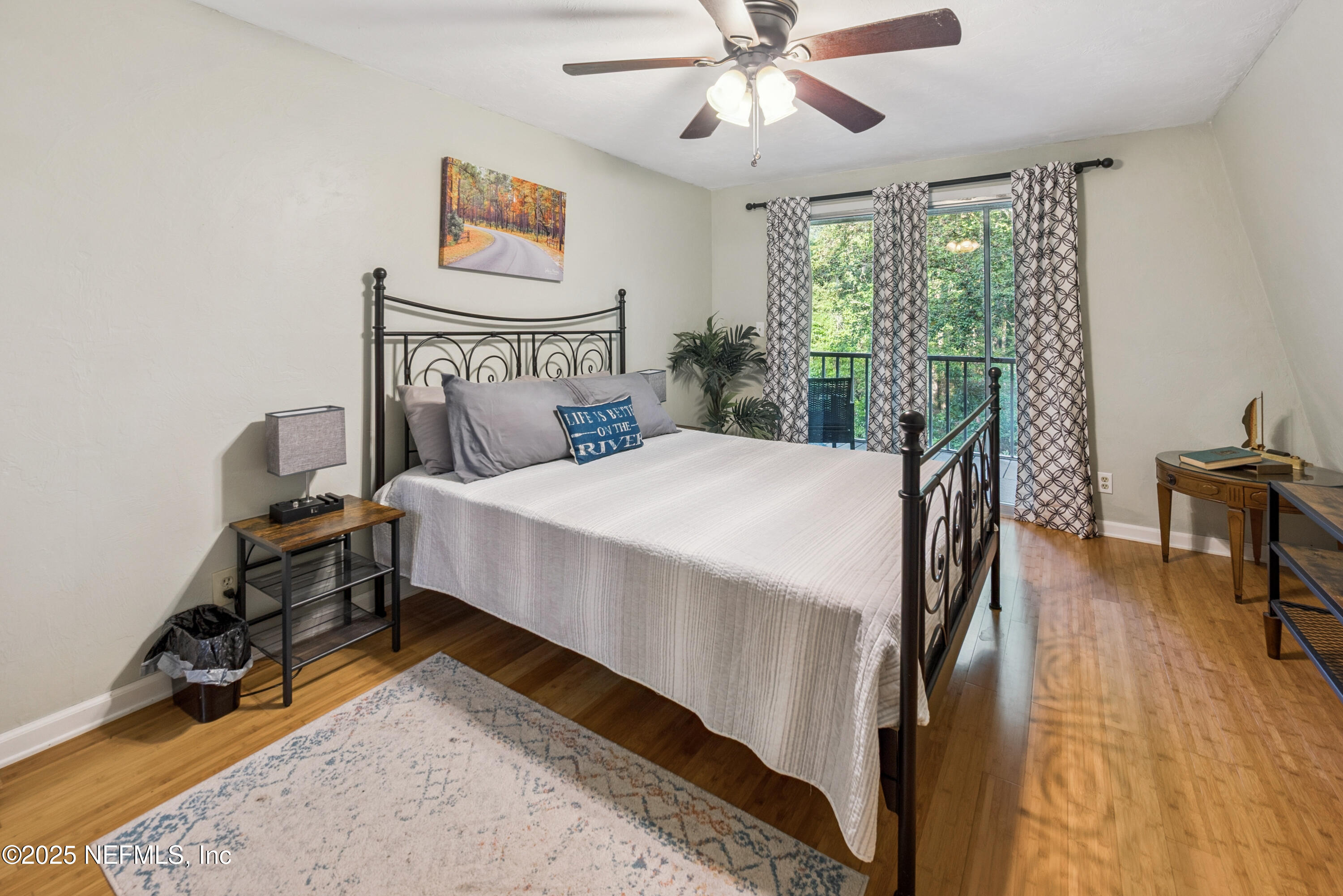 141 Southwest Longhorn Terrace Fort White, FL 32038 - Photo 14 of 31 a bedroom with a bed and a chandelier