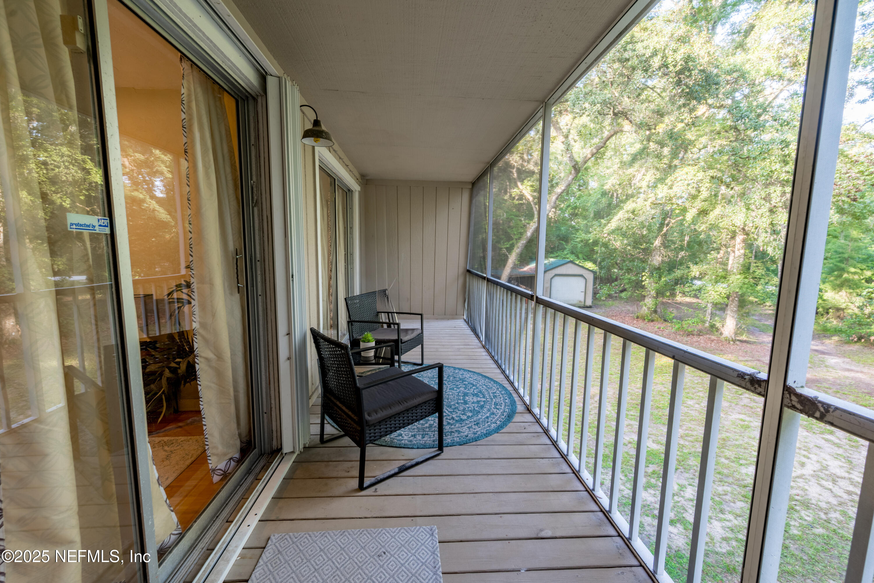 141 Southwest Longhorn Terrace Fort White, FL 32038 - Photo 21 of 31 a view of a balcony with furniture and floor to ceiling window
