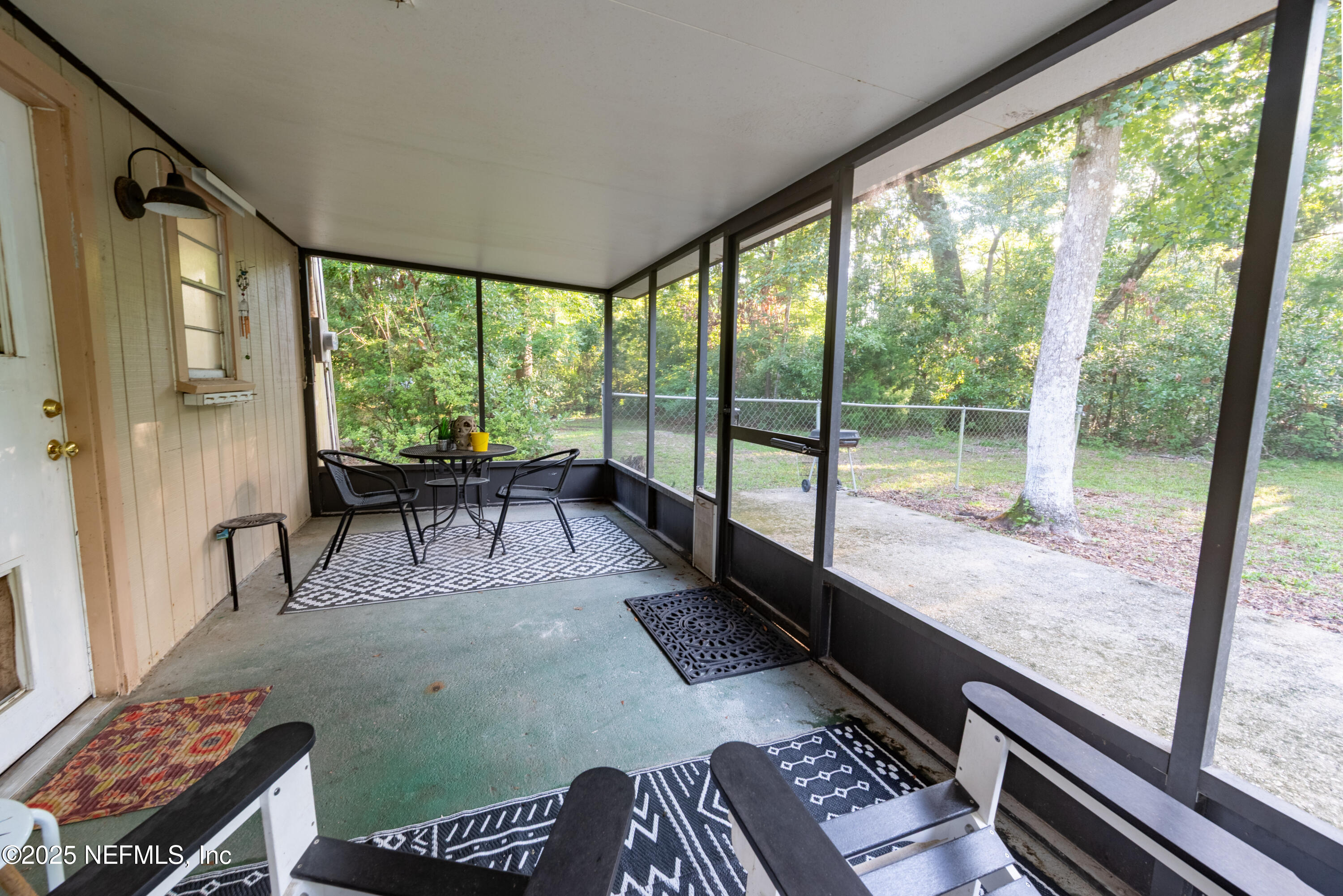 141 Southwest Longhorn Terrace Fort White, FL 32038 - Photo 23 of 31 a living room with a couch and a table