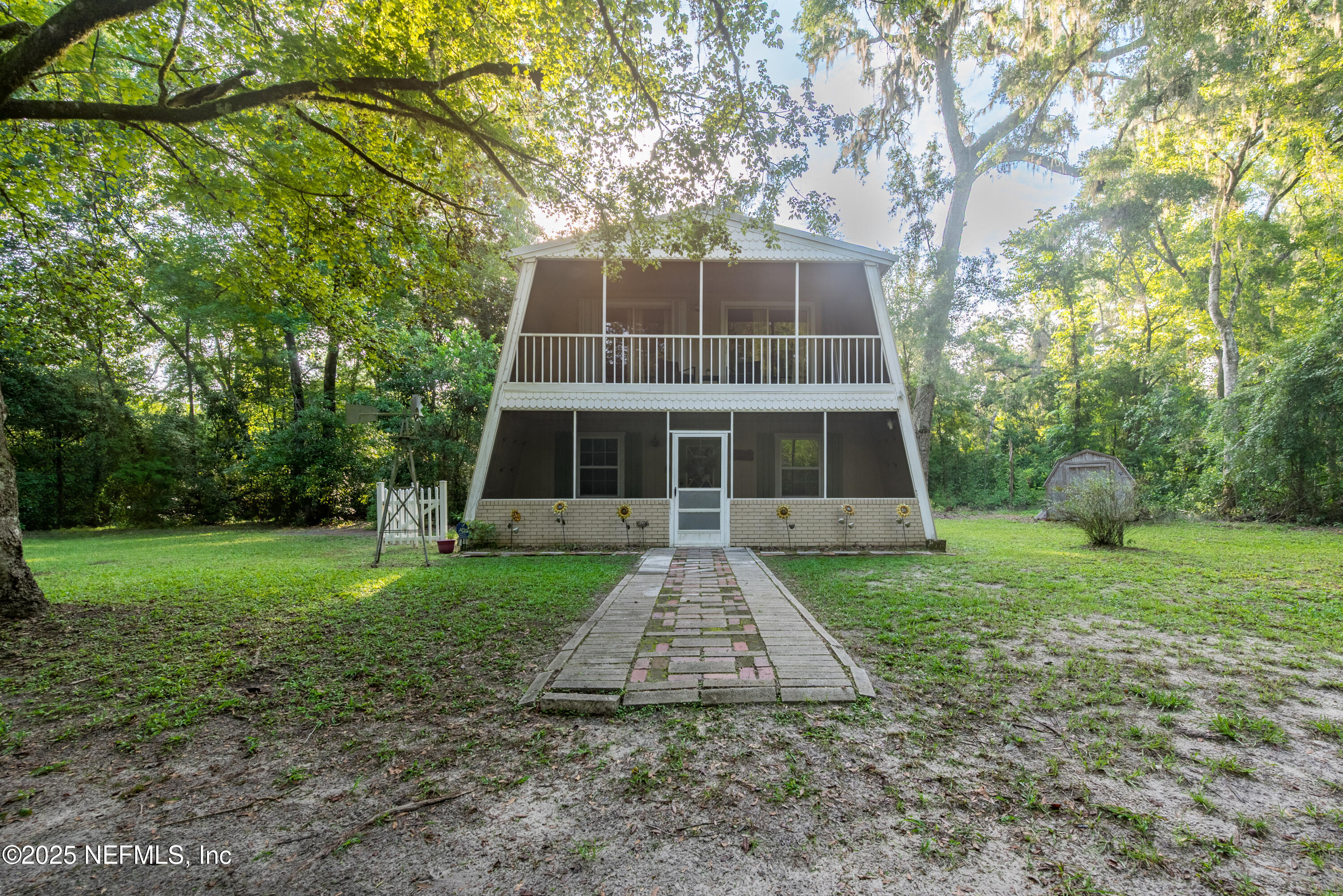141 Southwest Longhorn Terrace Fort White, FL 32038 - Photo 3 of 31 a front view of a house with a yard