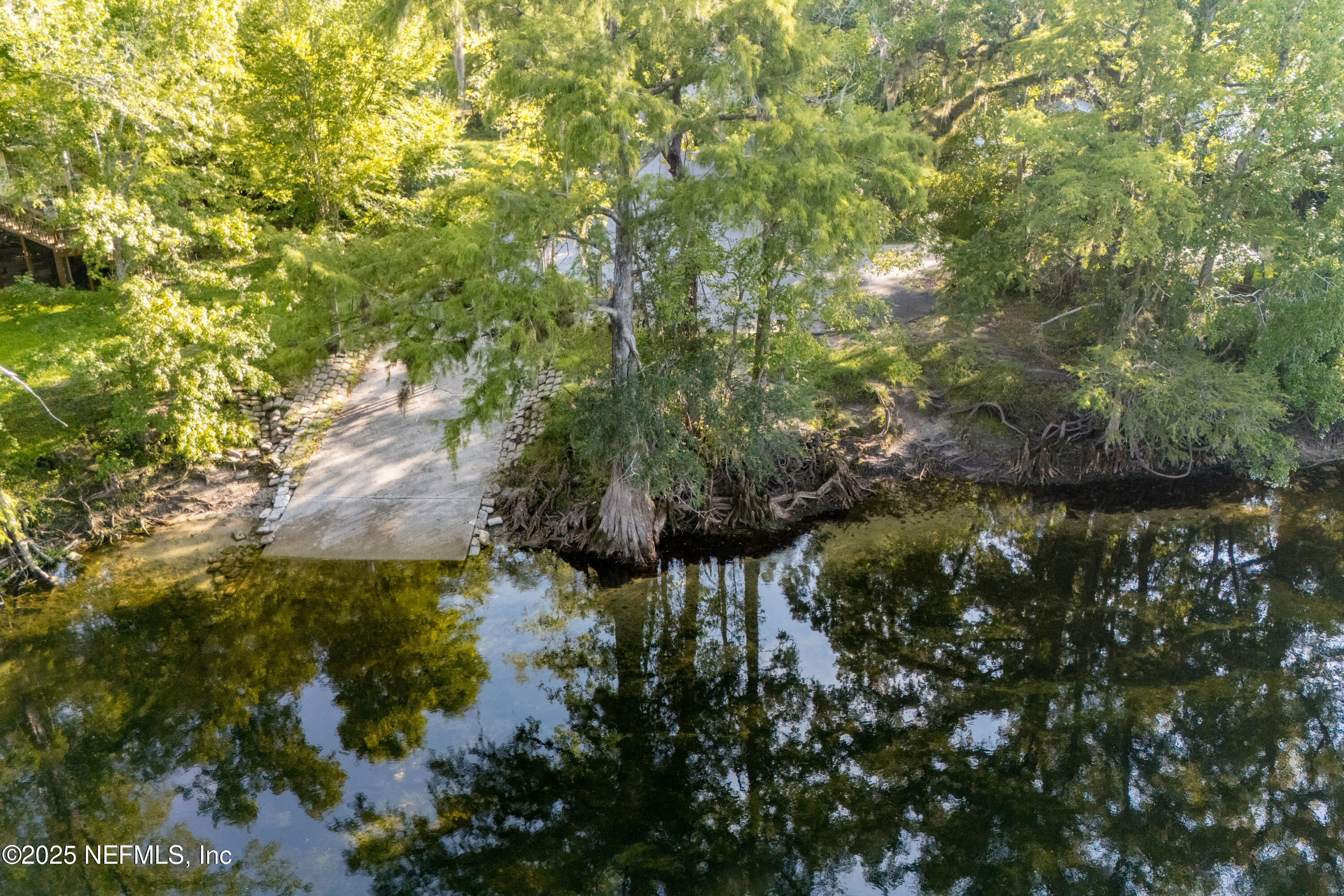 141 Southwest Longhorn Terrace Fort White, FL 32038 - Photo 5 of 31 a view of a lake with large trees