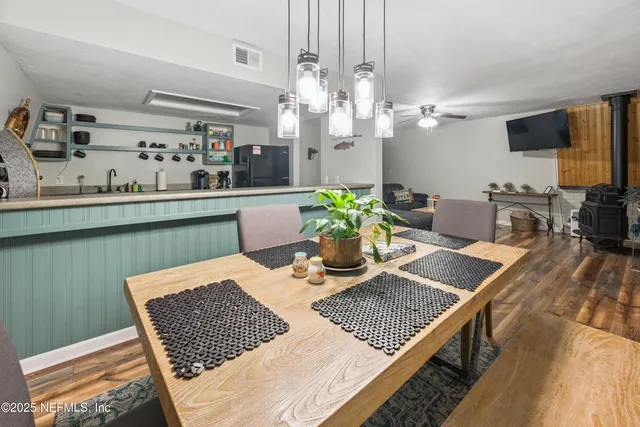 a kitchen with stainless steel appliances granite countertop a sink and a stove
