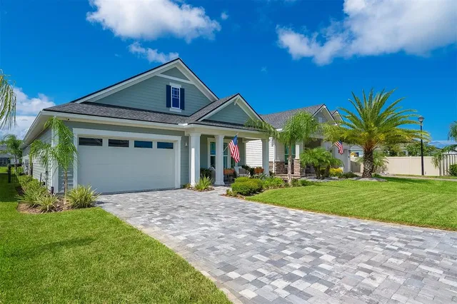 a front view of a house with a yard and porch