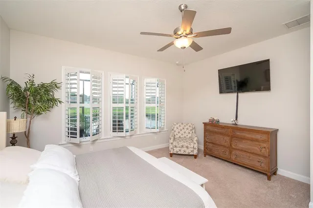 a kitchen with stainless steel appliances a table chairs and white cabinets