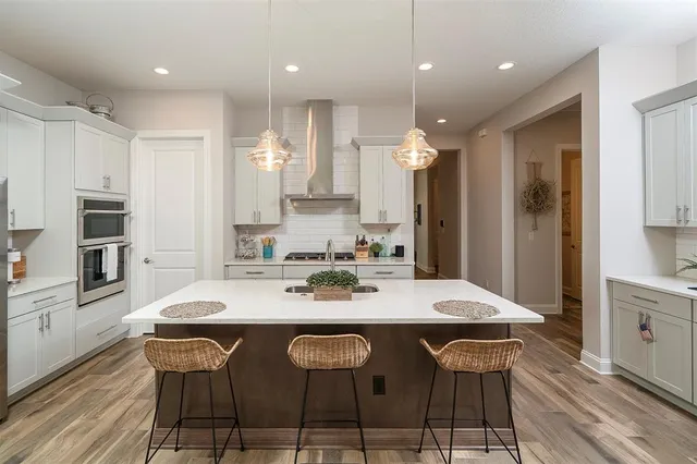 a bathroom with a sink toilet and mirror