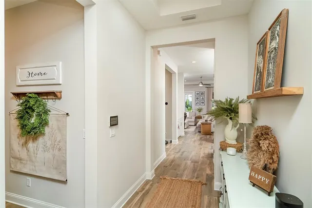 a living room with furniture fireplace and large window
