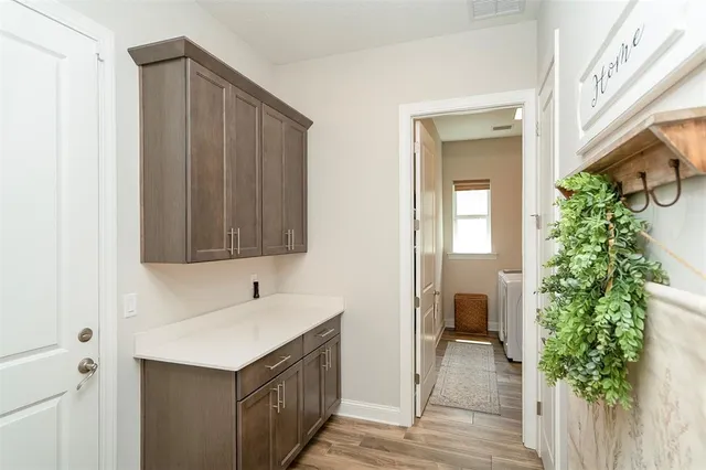 a view of a balcony with lake view and a potted plant