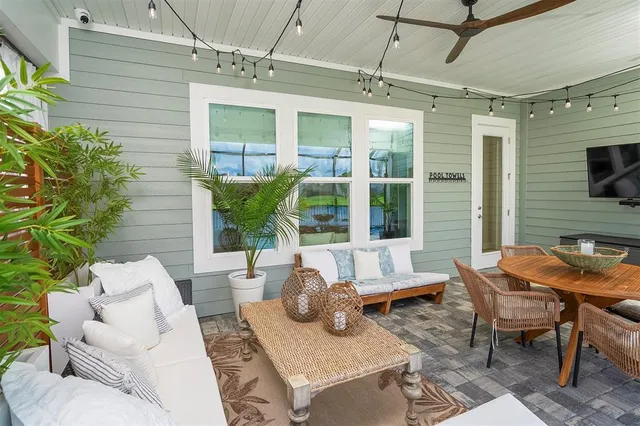a view of a patio with a dining table and chairs