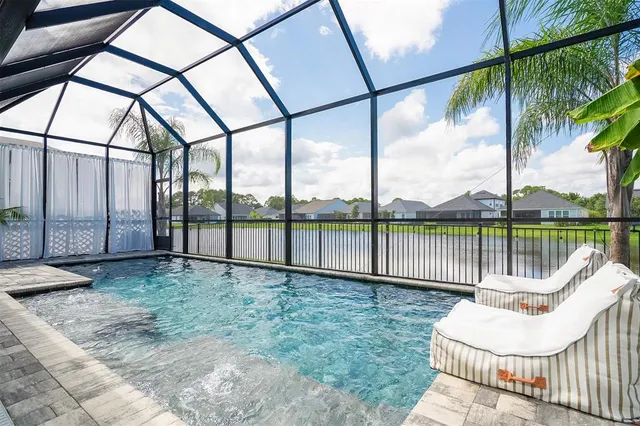 a street sign on a wall next to a building