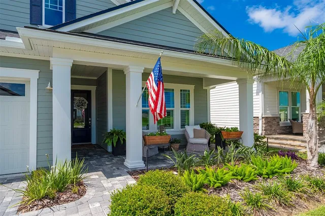 a bedroom with a bed dresser and a window