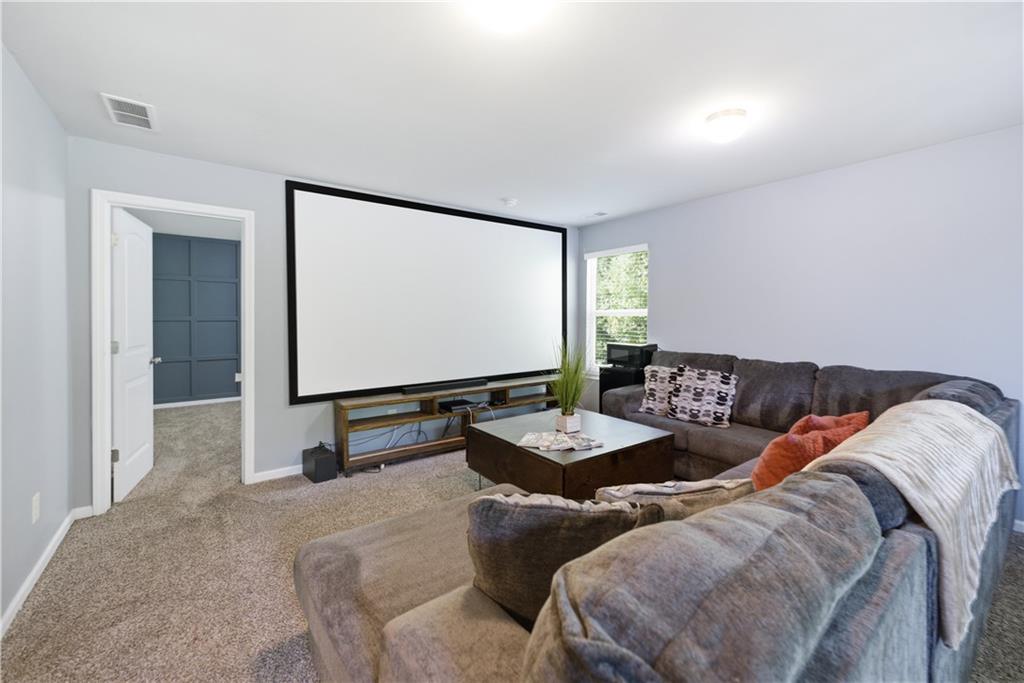 291 Boulder Run Hiram, GA 30141 - Photo 32 of 46 a living room with furniture and a flat screen tv