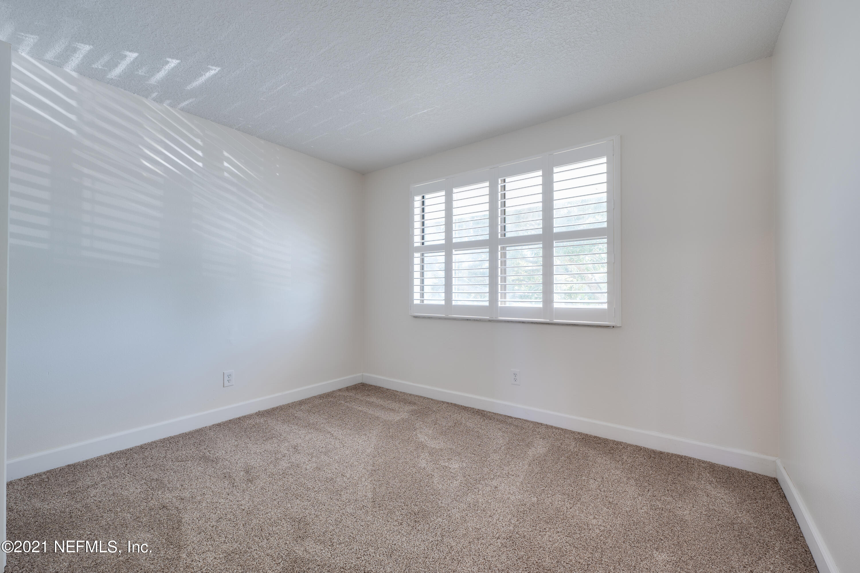 650 Pope Road, Unit 228 St. Augustine, FL 32080 - Photo 13 of 20 an empty room with a window
