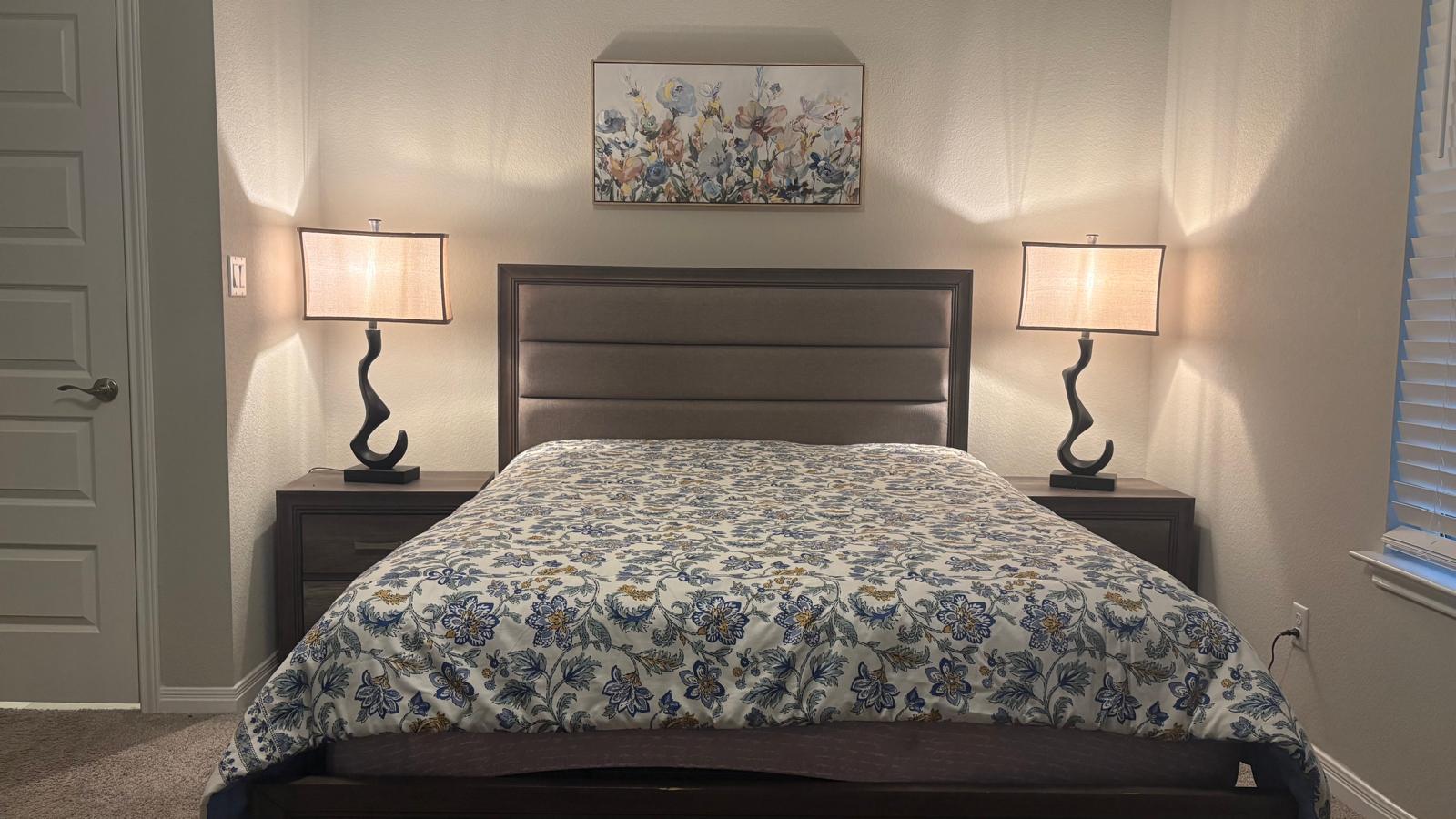 6511 Dragride Road Buda, TX 78610 - Photo 14 of 36 A well-lit bedroom features plush carpeting and convenient bedside tables.