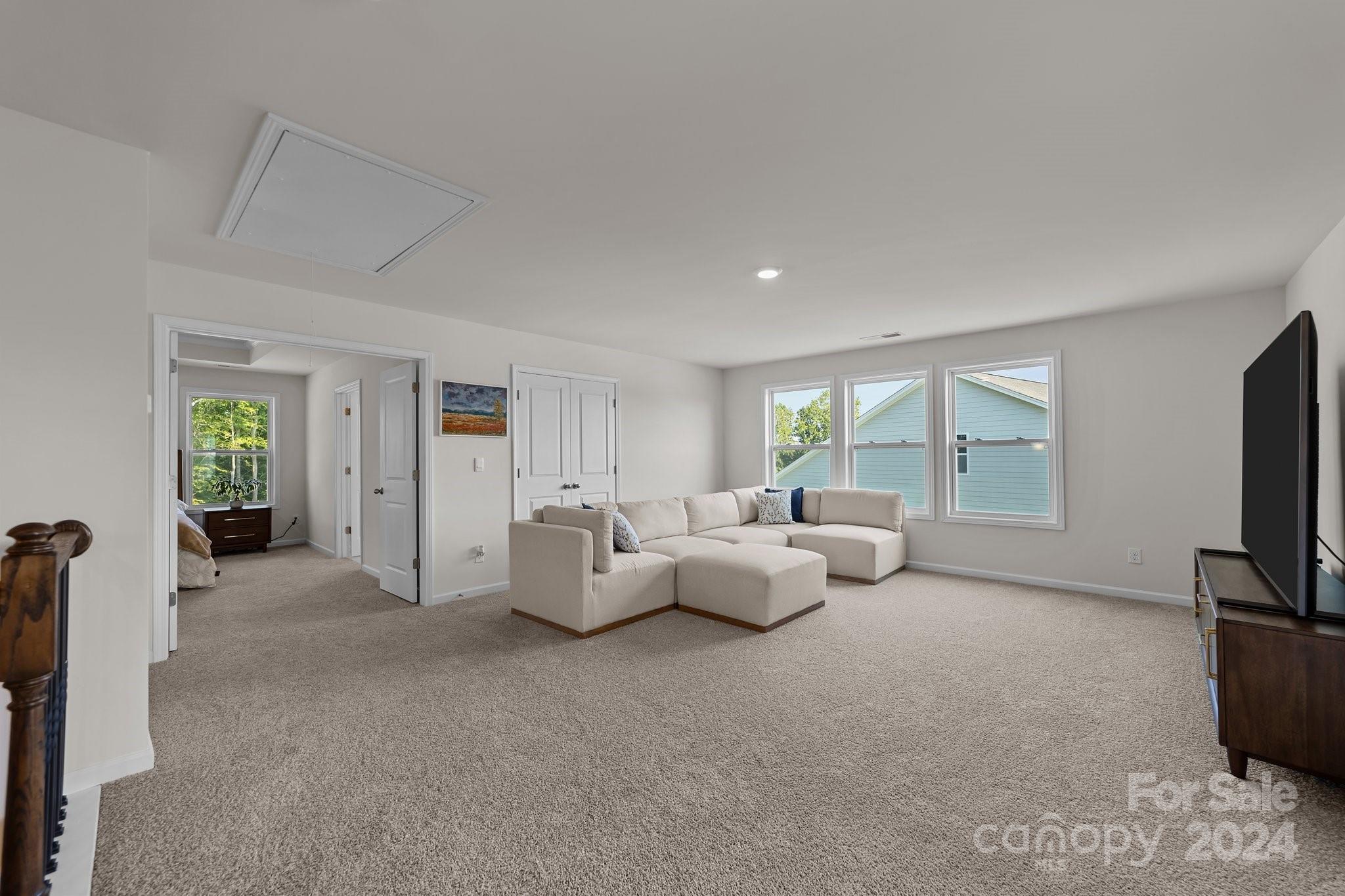6037 Treehouse Drive Charlotte, NC 28214 - Photo 21 of 48 a living room with furniture and a flat screen tv