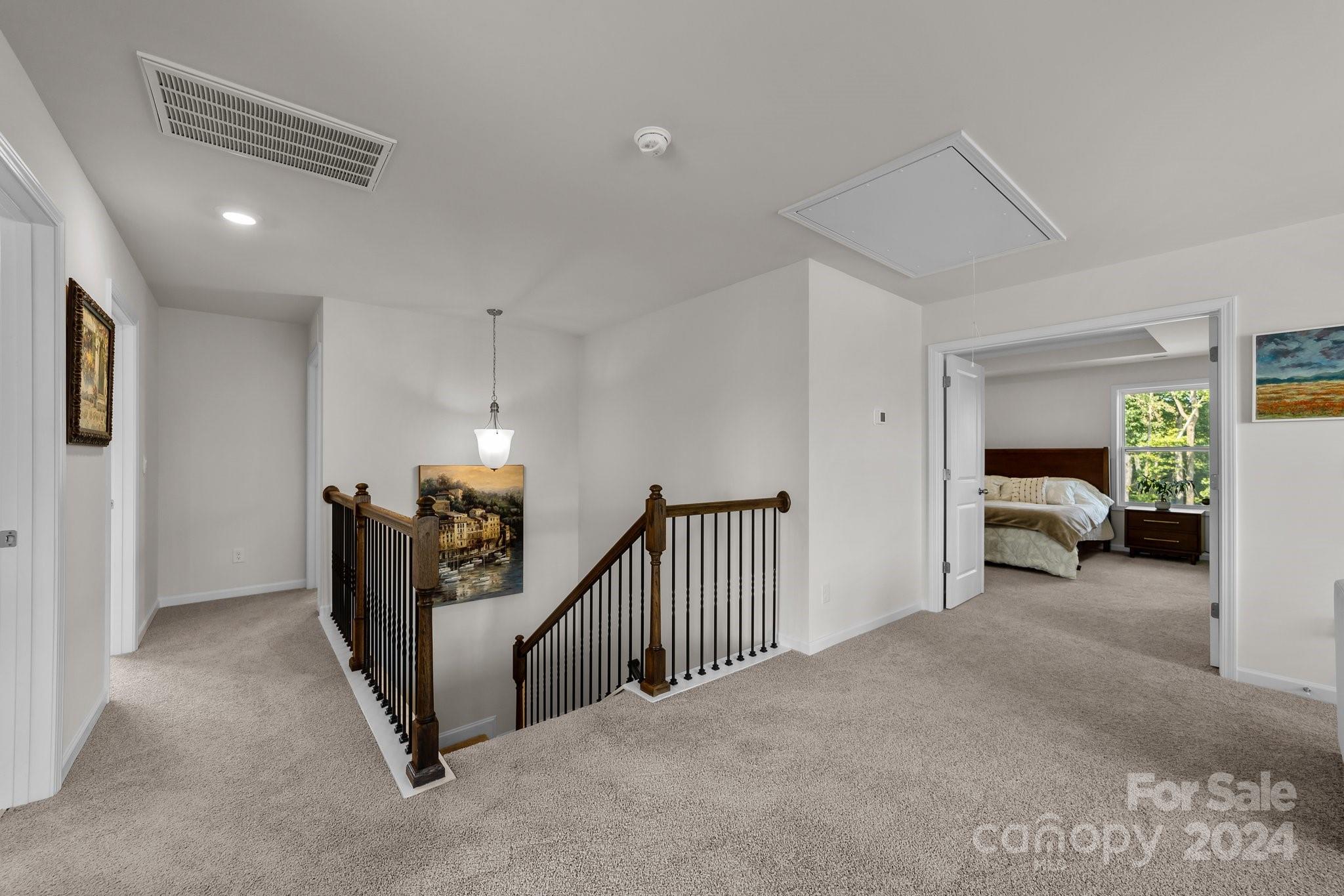 6037 Treehouse Drive Charlotte, NC 28214 - Photo 22 of 48 a view of a livingroom with furniture and a hallway