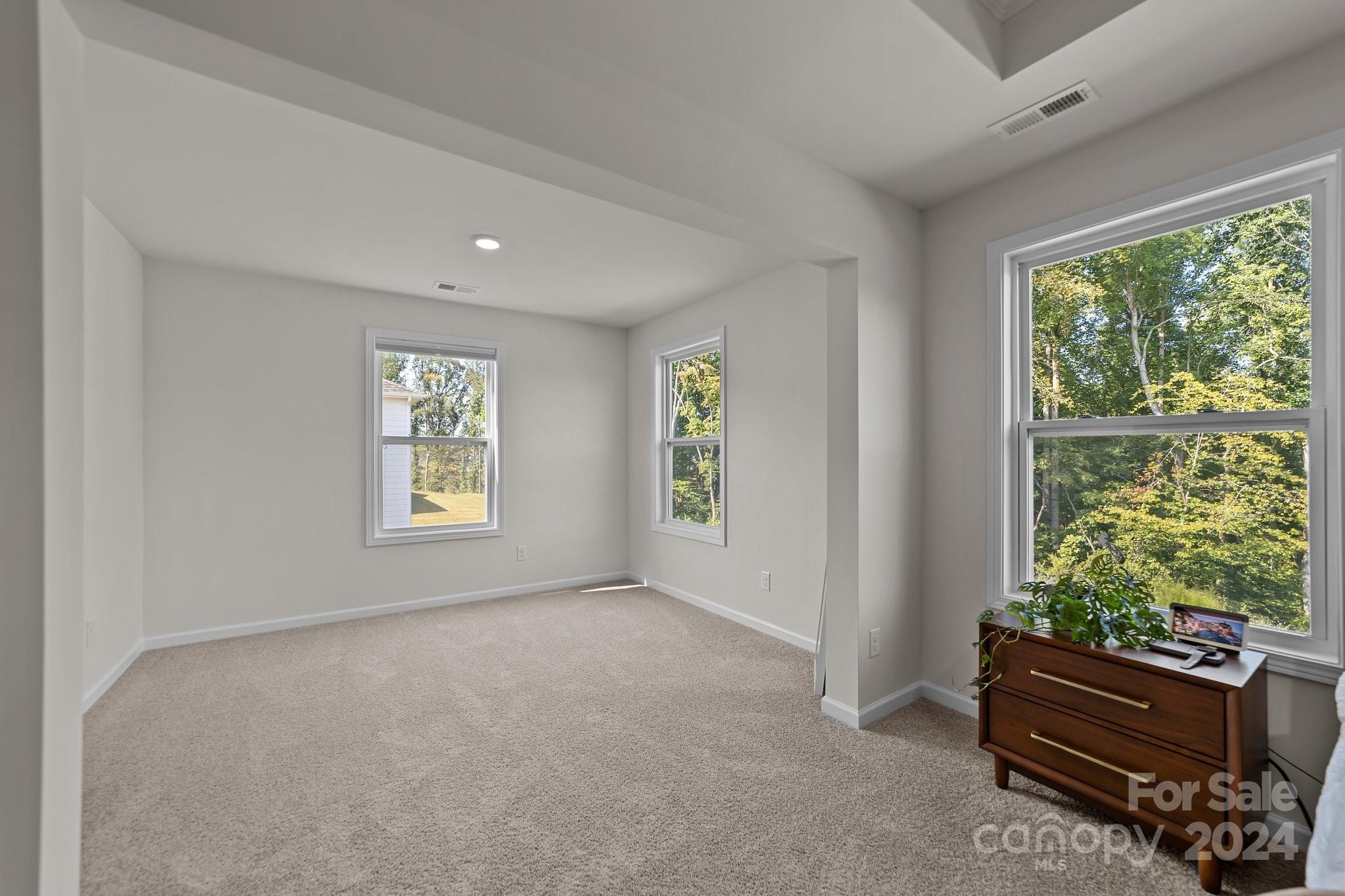 6037 Treehouse Drive Charlotte, NC 28214 - Photo 24 of 48 a view of room with window and air conditioner duct