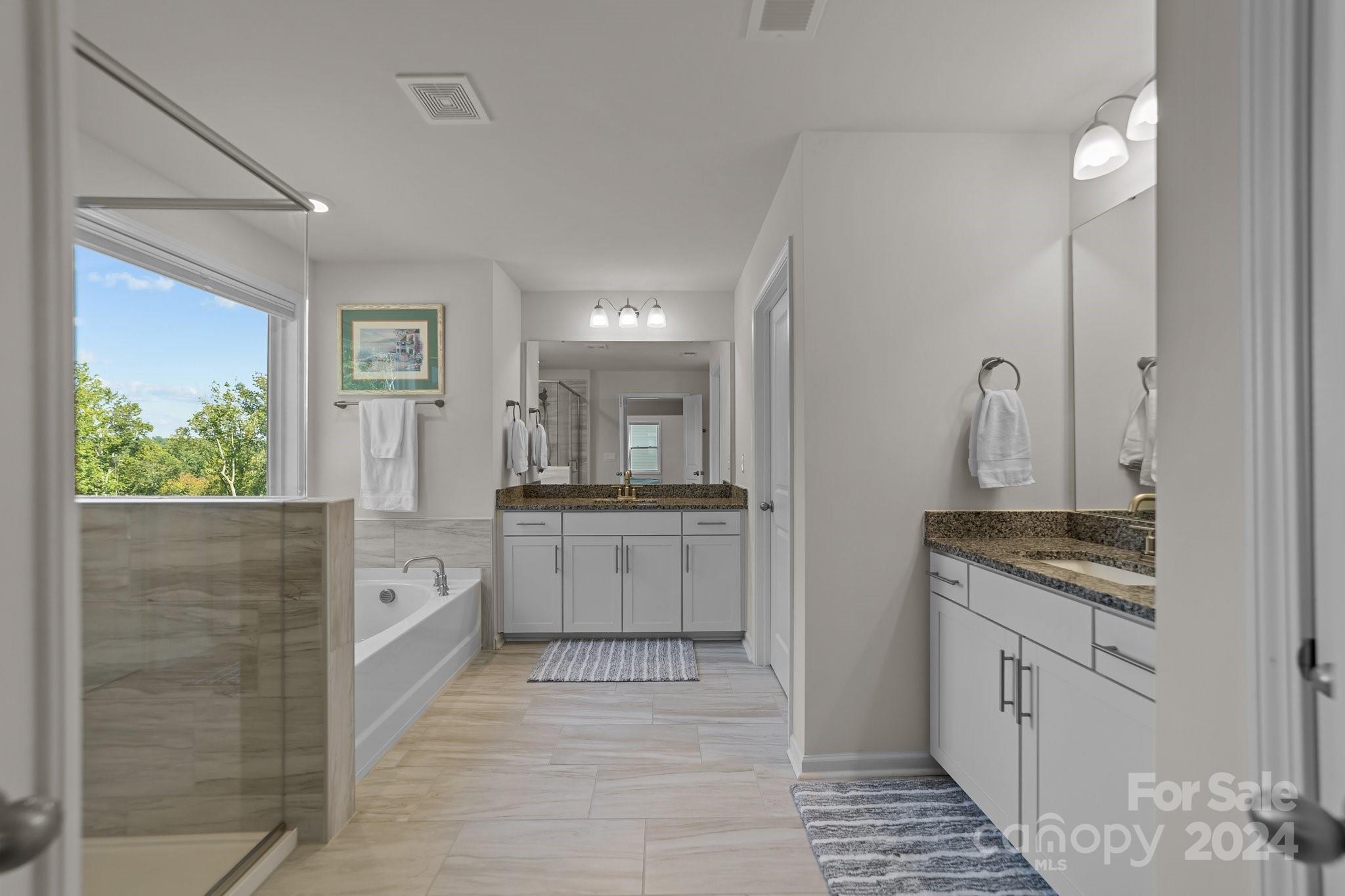 6037 Treehouse Drive Charlotte, NC 28214 - Photo 25 of 48 a kitchen with white cabinets and sink