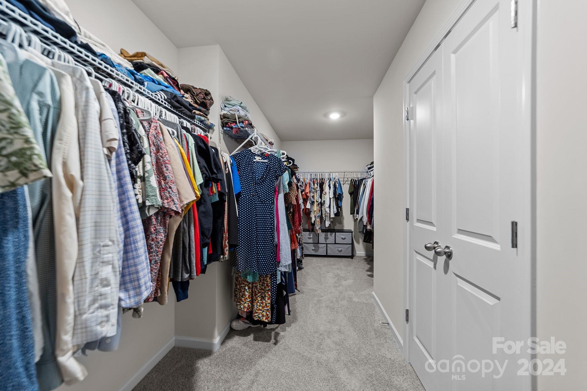 6037 Treehouse Drive Charlotte, NC 28214 - Photo 28 of 48 a view of walk in closet with clothes