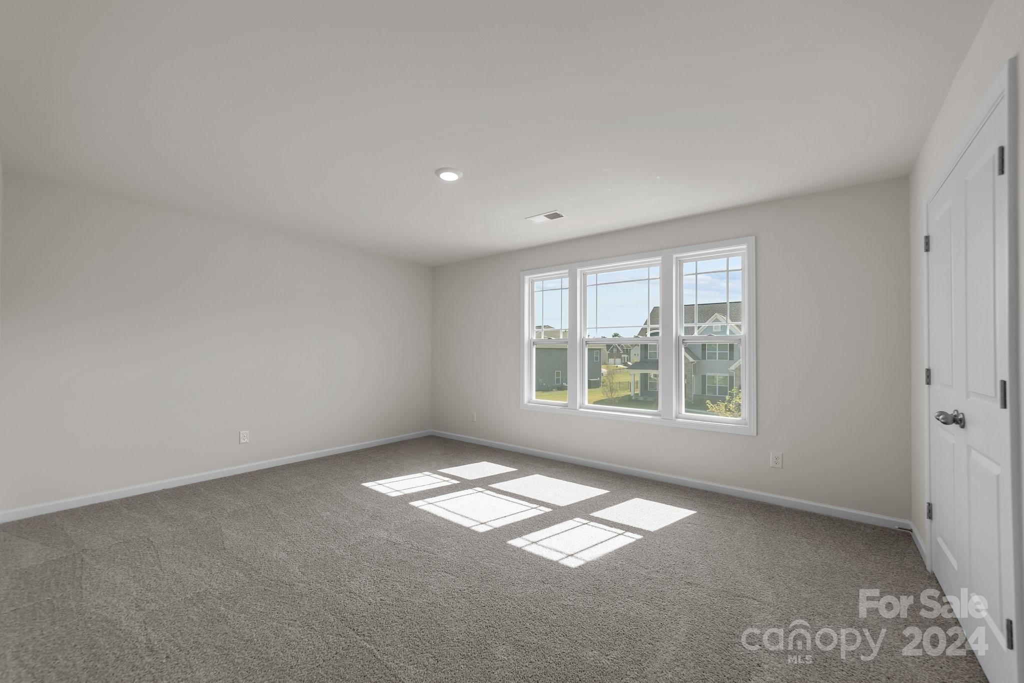 6037 Treehouse Drive Charlotte, NC 28214 - Photo 29 of 48 a view of empty room with window