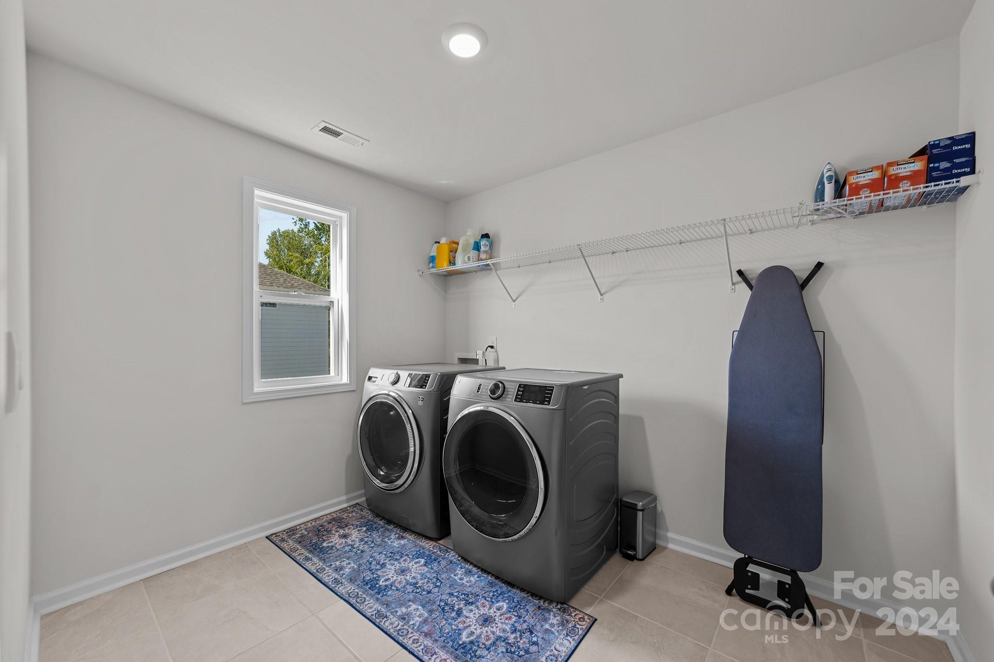 6037 Treehouse Drive Charlotte, NC 28214 - Photo 32 of 48 a utility room with dryer and washer
