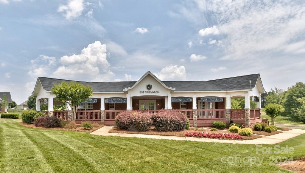 6037 Treehouse Drive Charlotte, NC 28214 - Photo 39 of 48 a front view of a house with a yard table and chairs