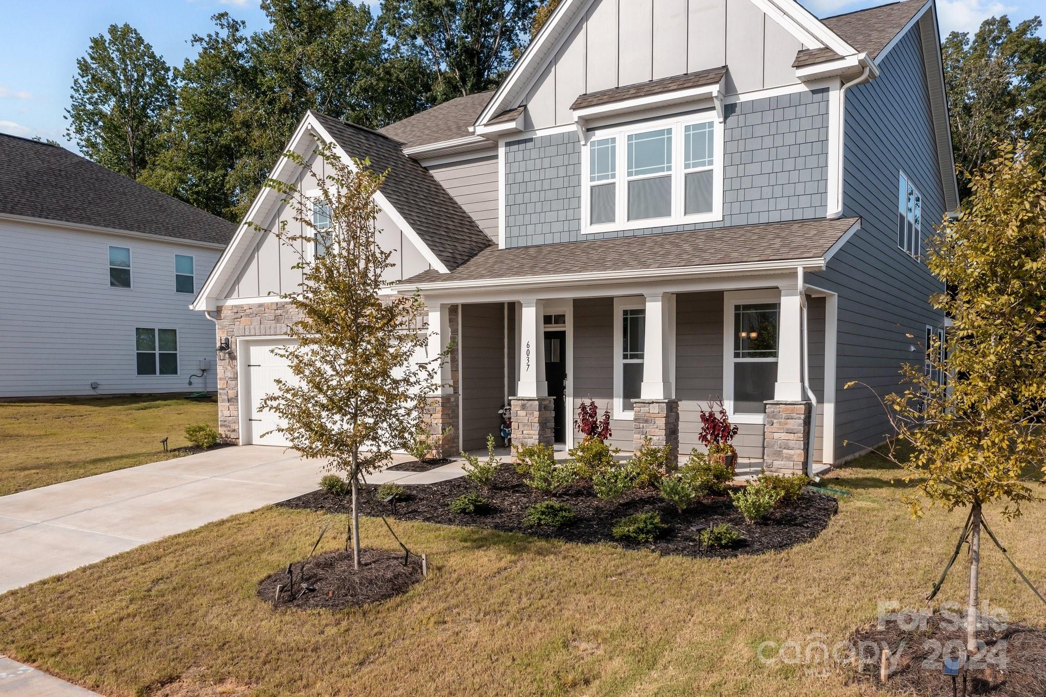 6037 Treehouse Drive Charlotte, NC 28214 - Photo 4 of 48 a front view of a house with a yard