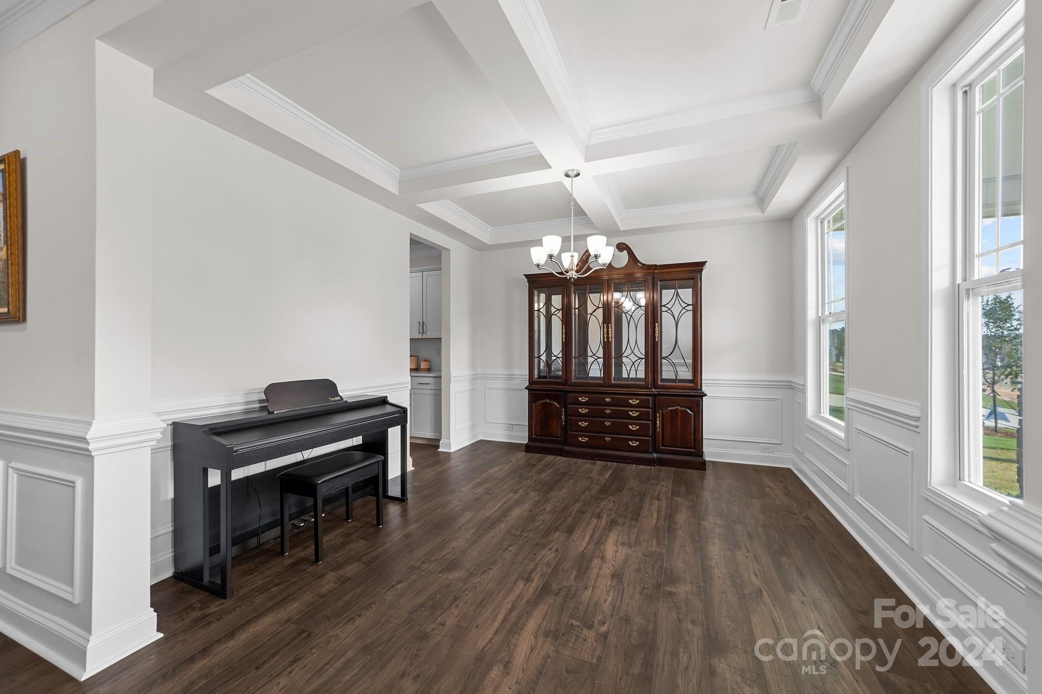 6037 Treehouse Drive Charlotte, NC 28214 - Photo 6 of 48 a view of a livingroom with hardwood floor and a ceiling fan