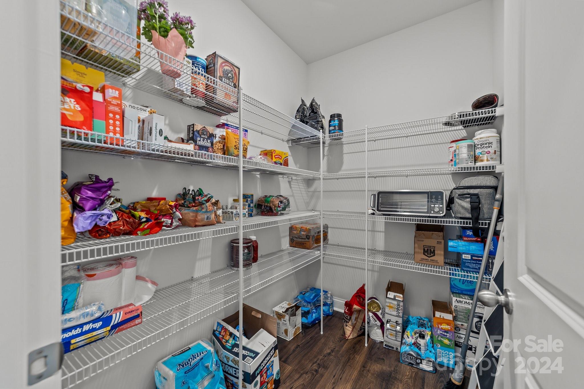 6037 Treehouse Drive Charlotte, NC 28214 - Photo 8 of 48 a kitchen with lots of clutter and cabinets