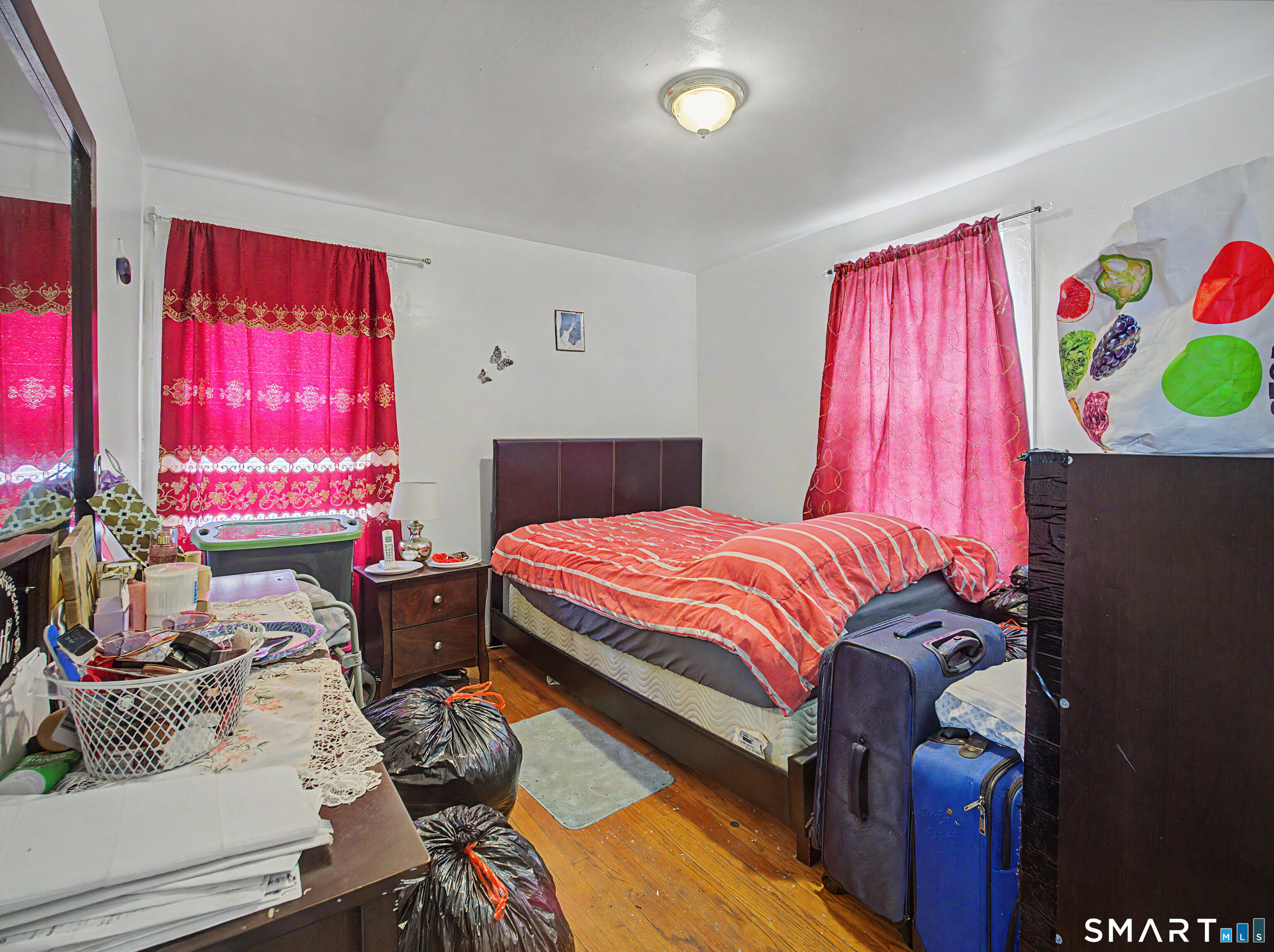 319 Carroll Avenue Bridgeport, CT 06607 - Photo 15 of 40 a bedroom with a bed and glass window