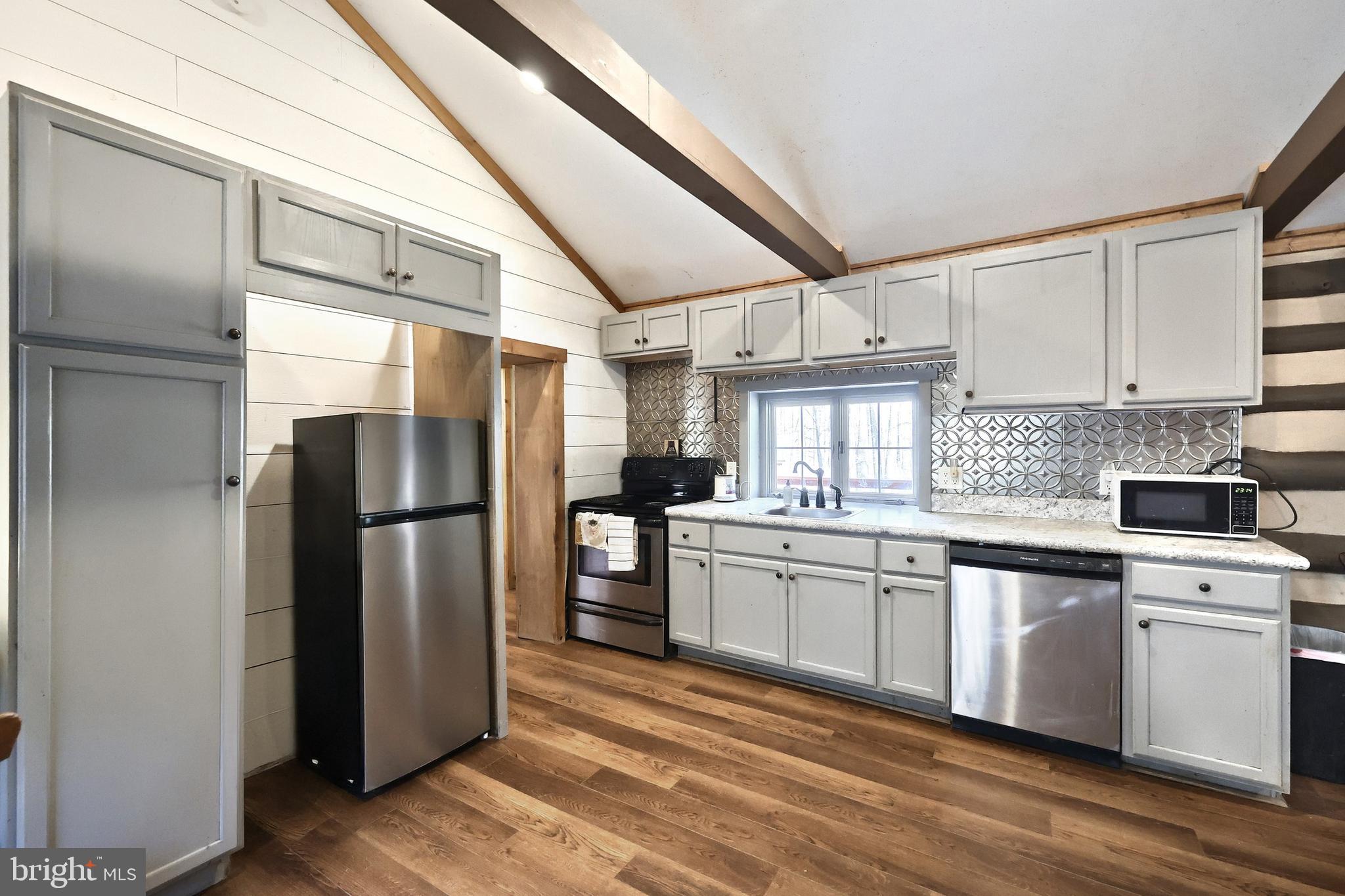 6227 Pigeon Hill Road Spring Grove, PA 17362 - Photo 10 of 50 a kitchen with stainless steel appliances a refrigerator sink and cabinets