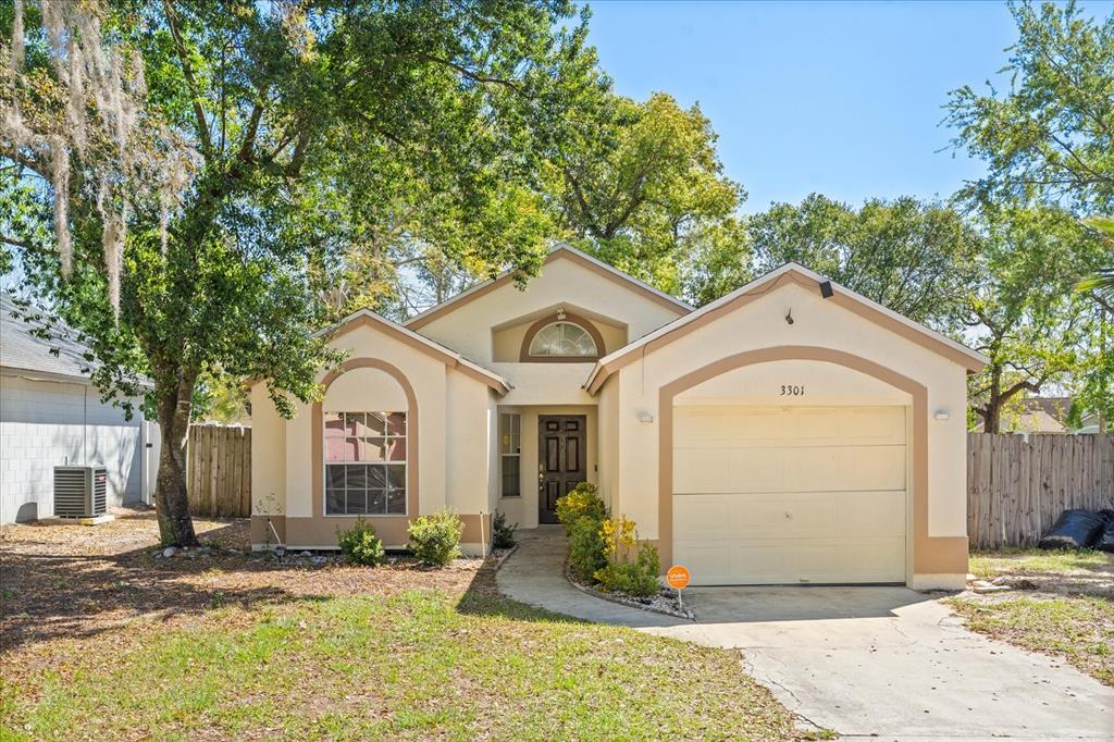 Undisclosed Address Orlando, FL 32818 - Photo 1 of 1 a front view of a house with garden