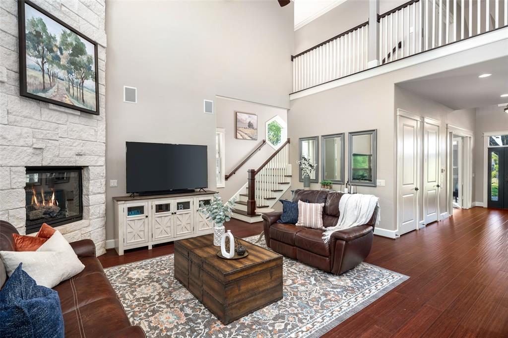 1814 Stacy Road Fairview, TX 75069 - Photo 11 of 33 Floor to ceiling stone gas insert fireplace; perfect amount of natural light; high ceiling