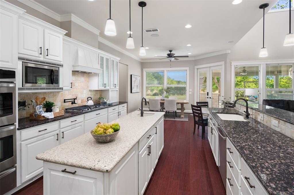 1814 Stacy Road Fairview, TX 75069 - Photo 8 of 33 Double ovens; gas cook top; pot filler; room to seat up to 10 guests