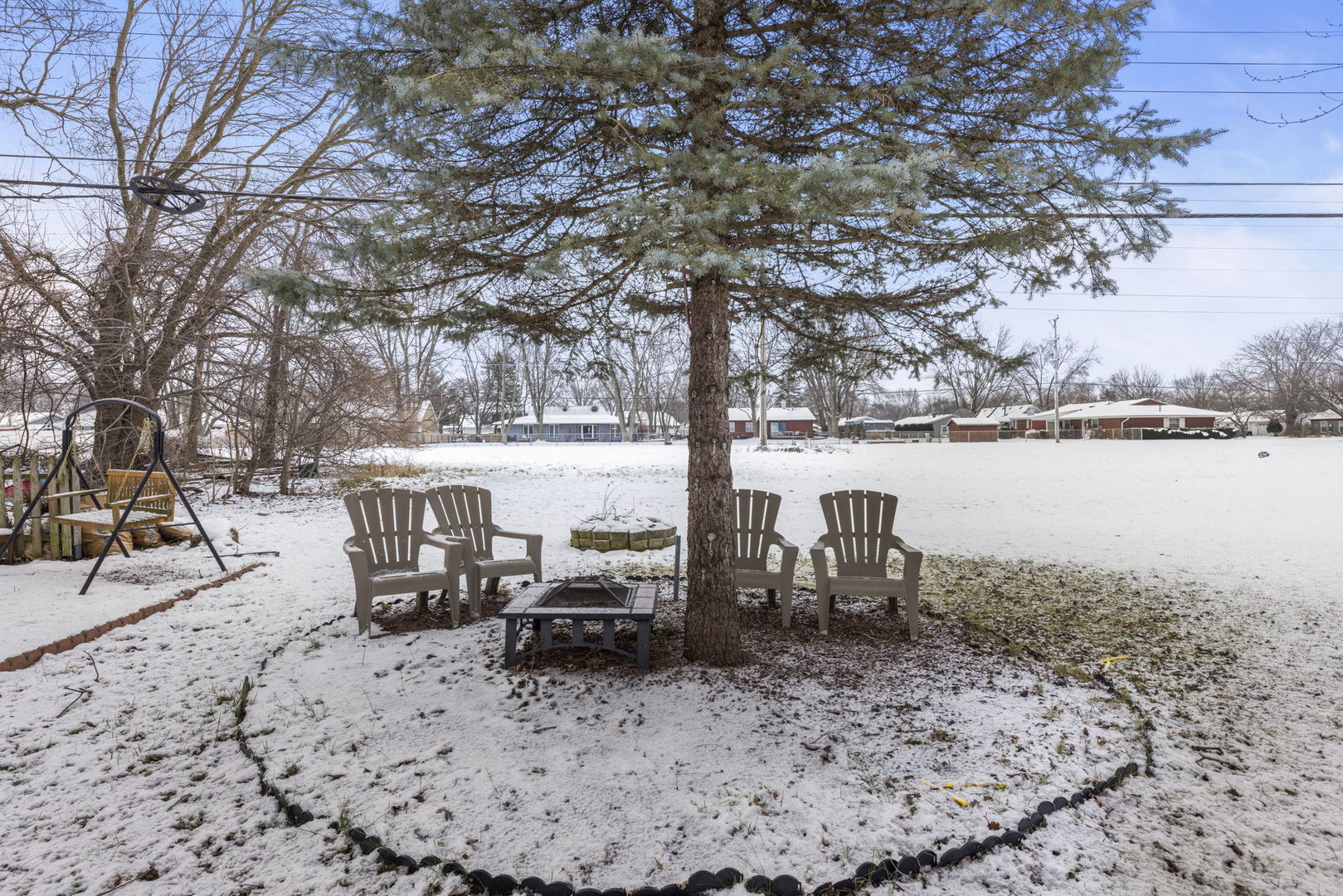 6 Saugatuck Road Montgomery, IL 60538 - Photo 23 of 25 a view of a lake with outdoor seating space