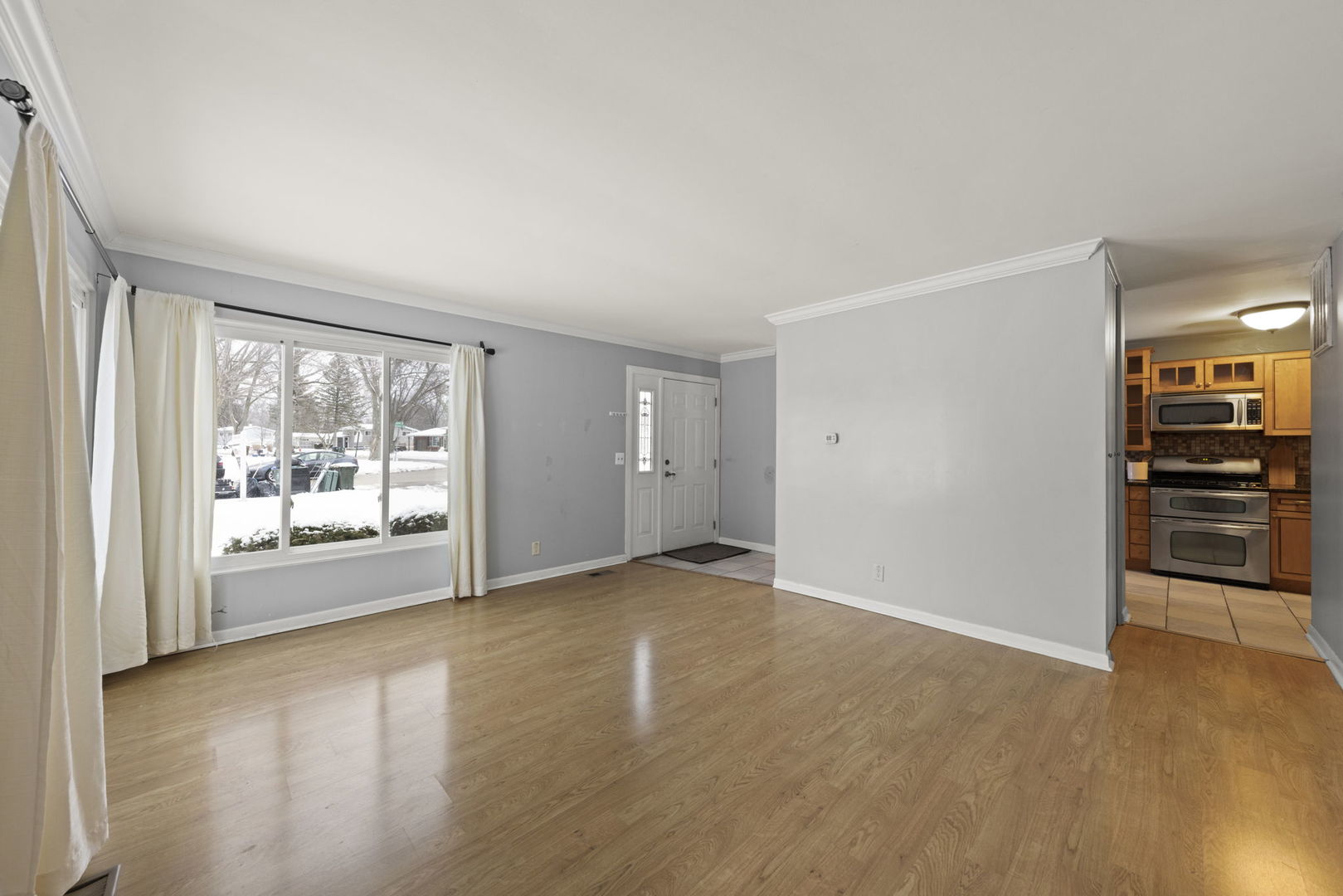 6 Saugatuck Road Montgomery, IL 60538 - Photo 6 of 25 wooden floor in an empty room with a window