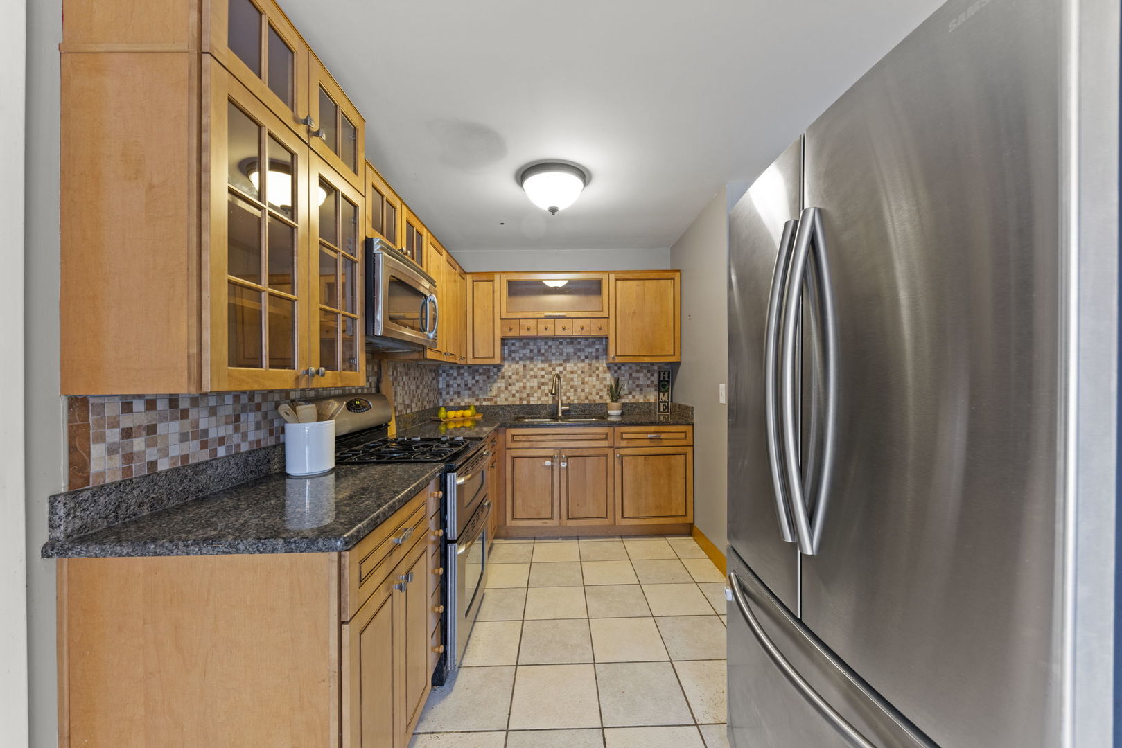 6 Saugatuck Road Montgomery, IL 60538 - Photo 8 of 25 a kitchen with stainless steel appliances granite countertop a refrigerator and a stove