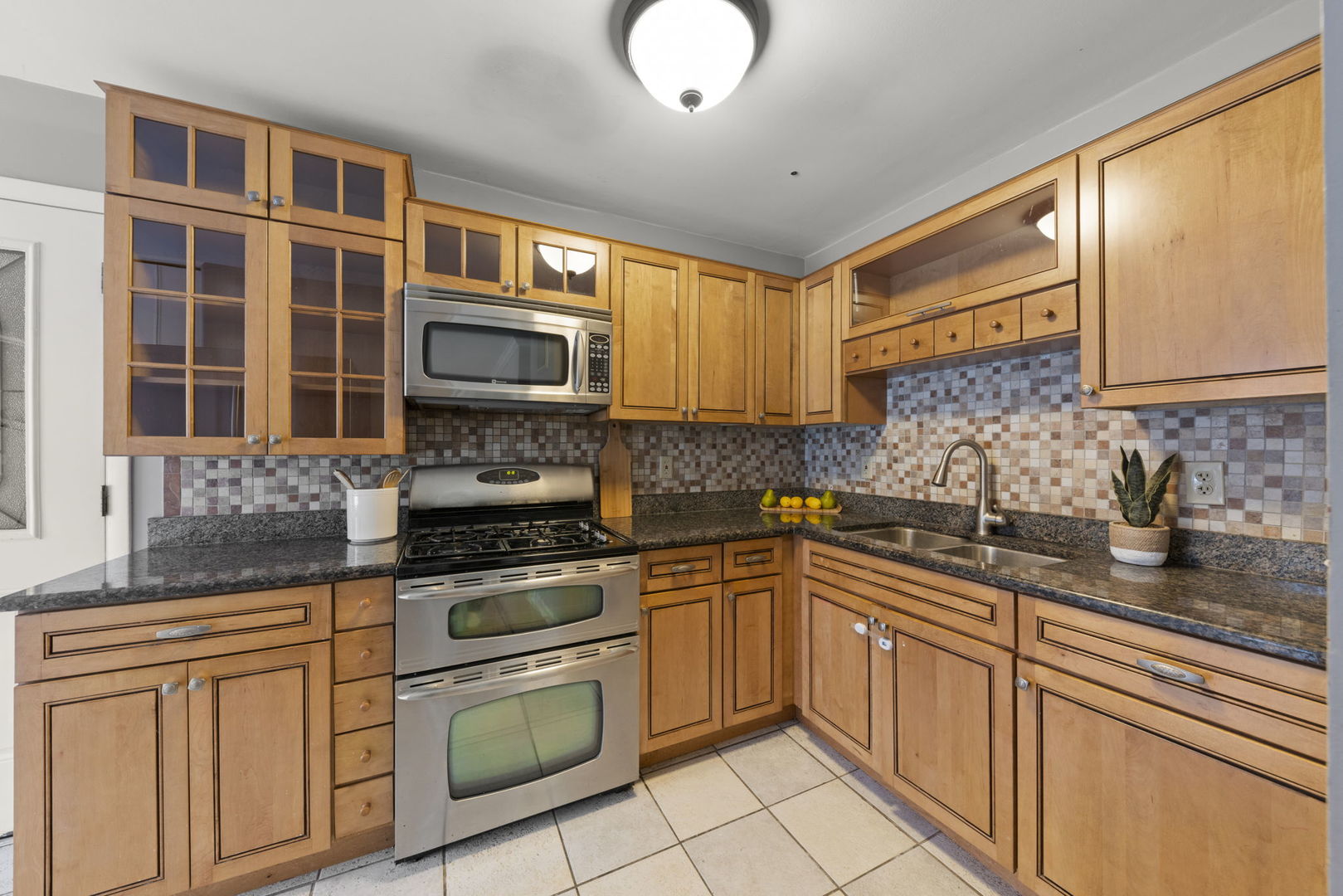 6 Saugatuck Road Montgomery, IL 60538 - Photo 9 of 25 a kitchen with stainless steel appliances granite countertop a sink stove and cabinets