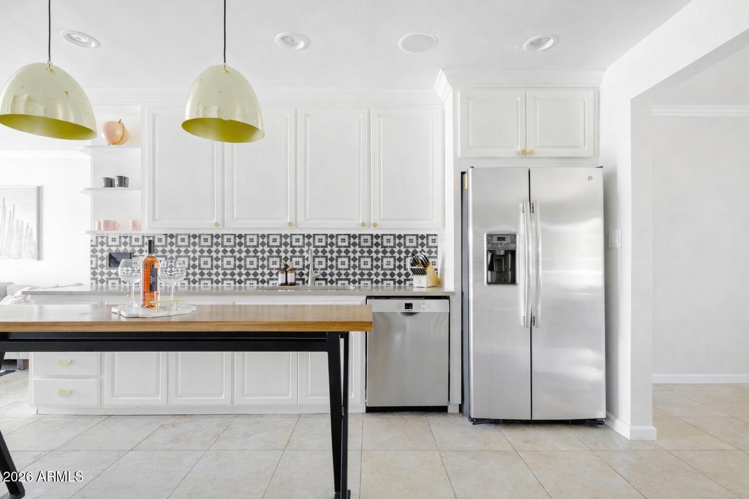 6810 East Granada Road Scottsdale, AZ 85257 - Photo 13 of 34 a view of kitchen with granite countertop stainless steel appliances a sink and a refrigerator