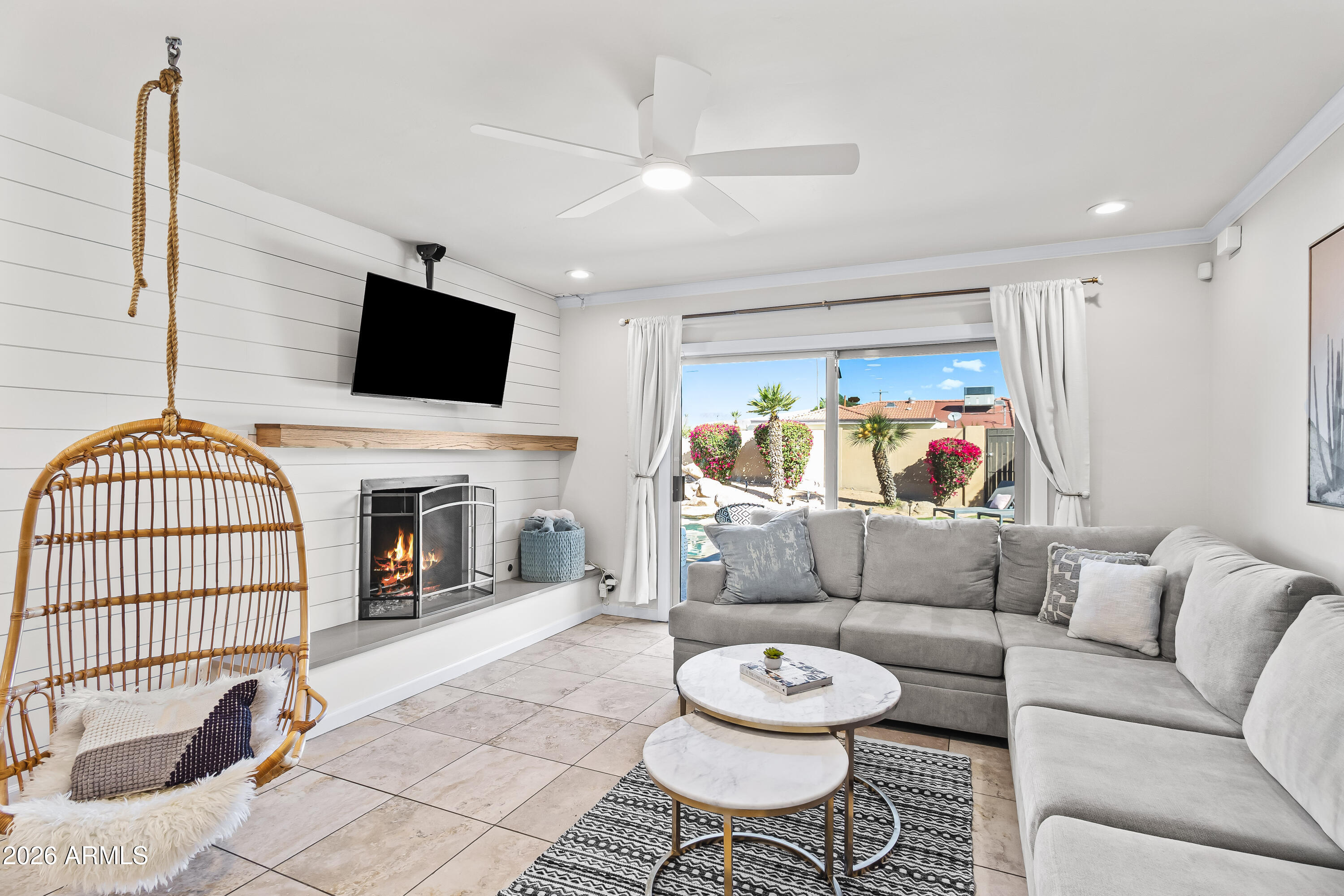 6810 East Granada Road Scottsdale, AZ 85257 - Photo 15 of 34 a living room with furniture and a flat screen tv