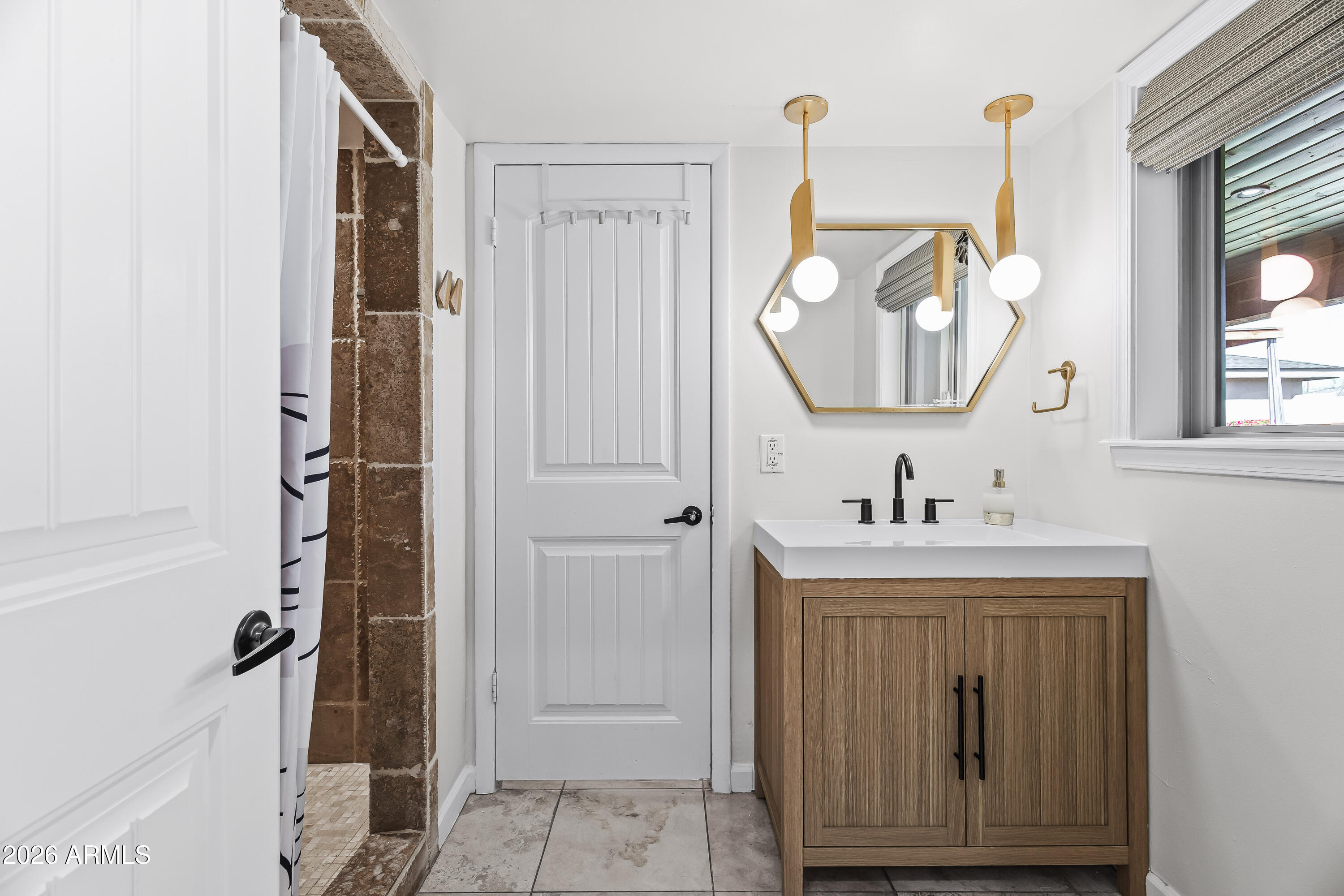 6810 East Granada Road Scottsdale, AZ 85257 - Photo 19 of 34 a bathroom with a sink and a mirror
