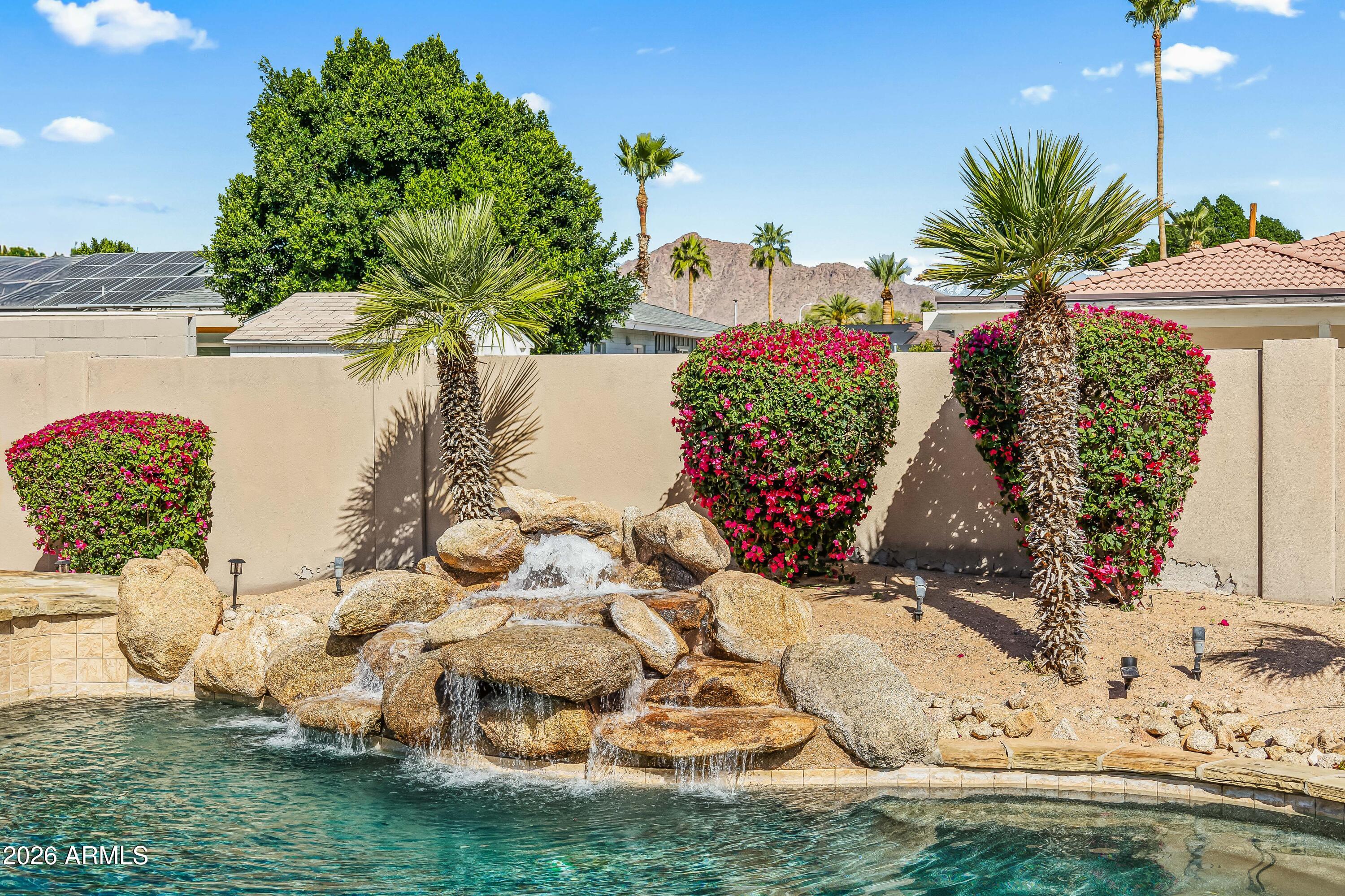 6810 East Granada Road Scottsdale, AZ 85257 - Photo 2 of 34 a view of a vase of flowers sitting on a table