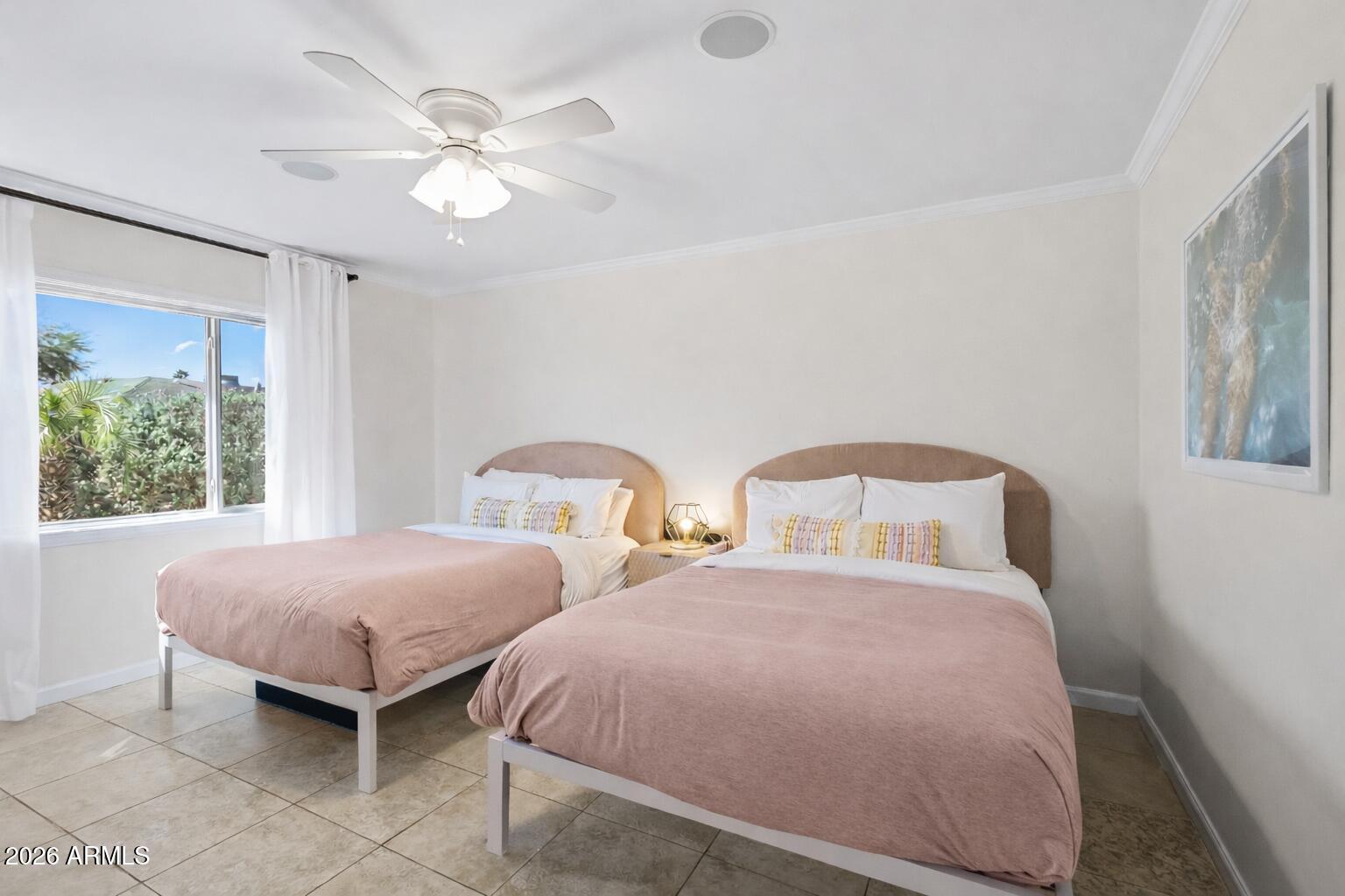 6810 East Granada Road Scottsdale, AZ 85257 - Photo 21 of 34 a bedroom with two beds and windows