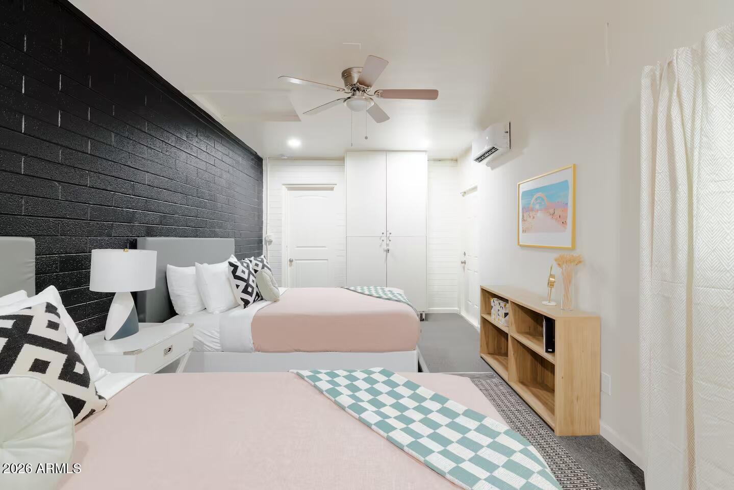 6810 East Granada Road Scottsdale, AZ 85257 - Photo 29 of 34 a bedroom with a bed and a chandelier