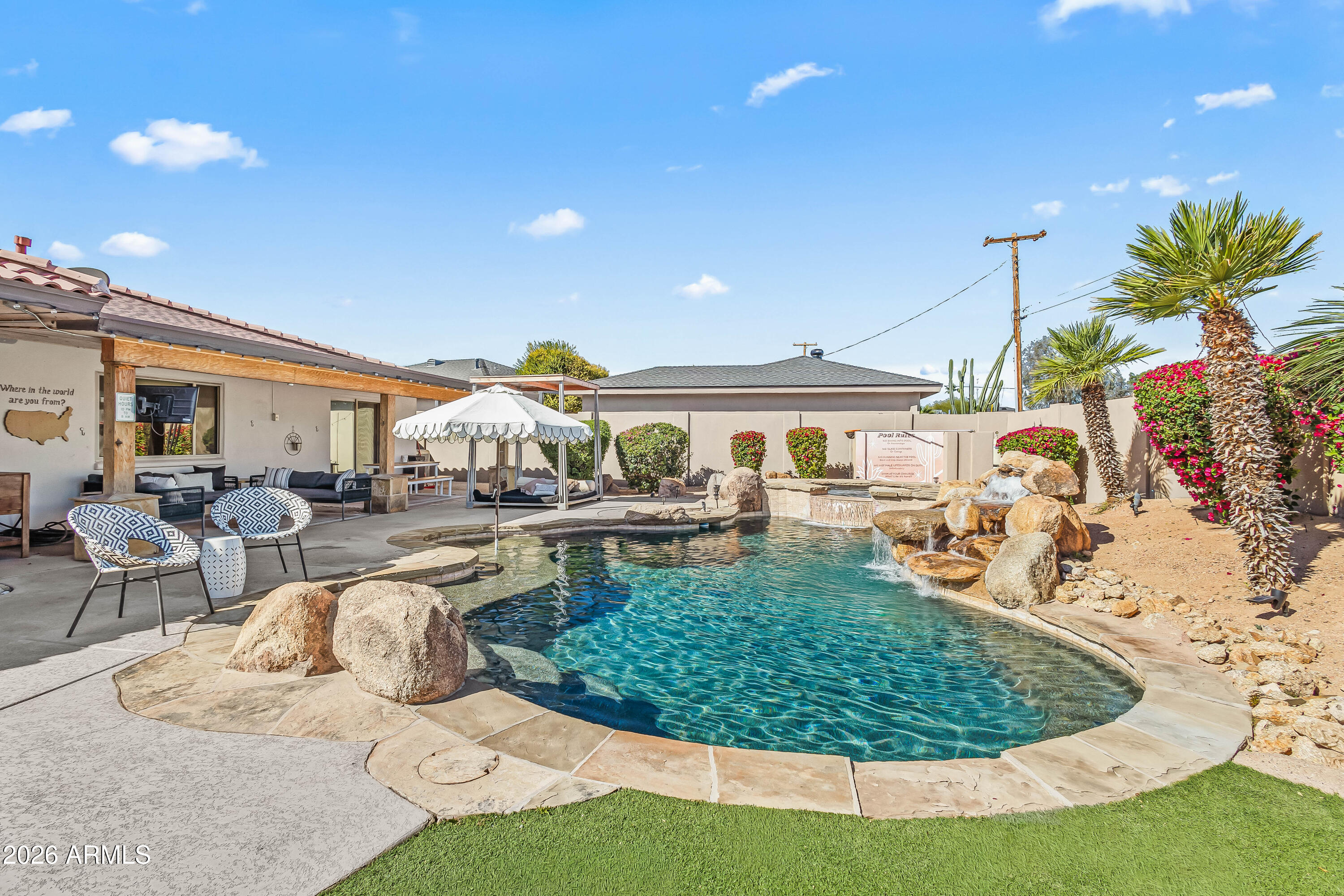 6810 East Granada Road Scottsdale, AZ 85257 - Photo 30 of 34 a view of a house with swimming pool and sitting area