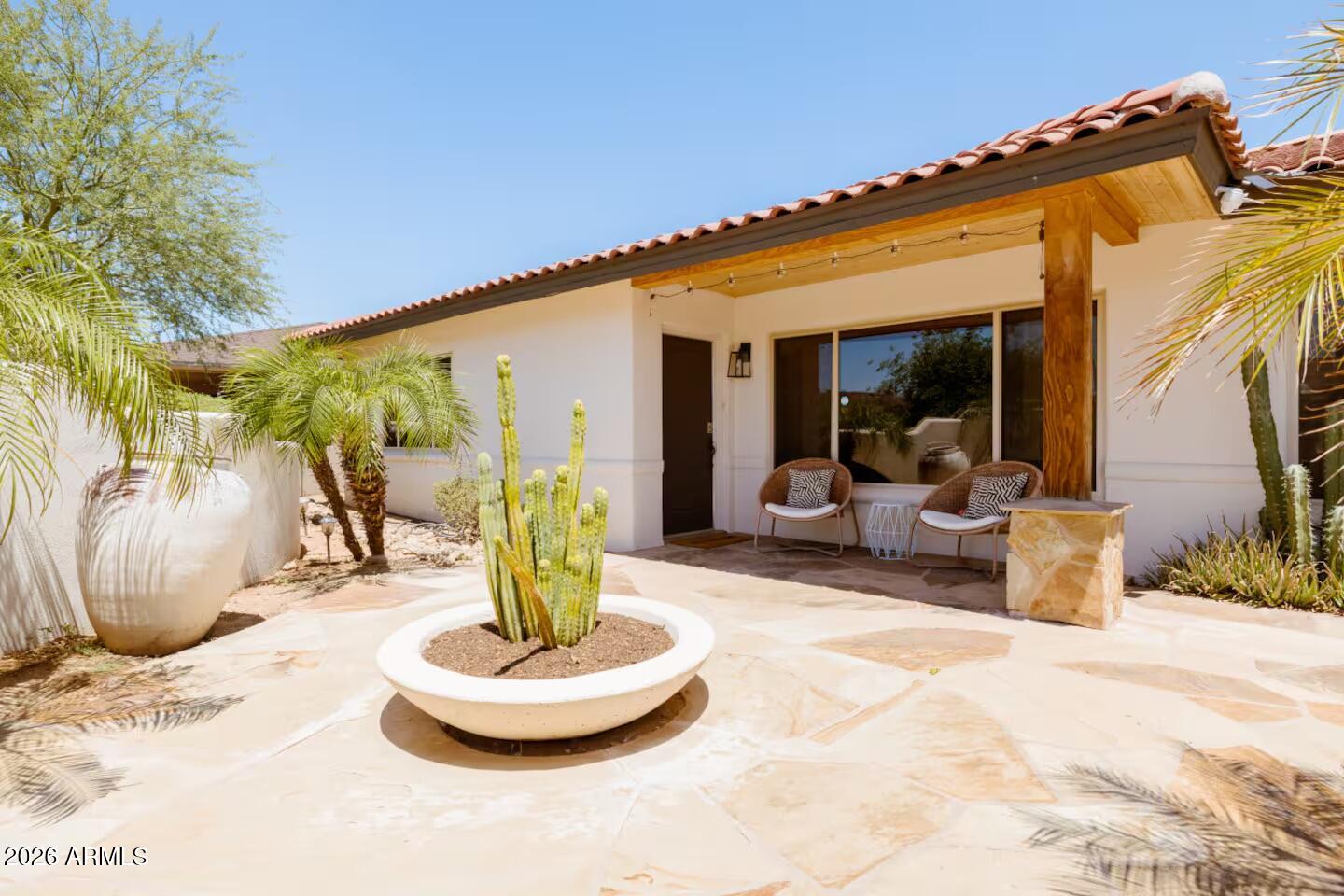 6810 East Granada Road Scottsdale, AZ 85257 - Photo 3 of 34 a view of a living room with a patio