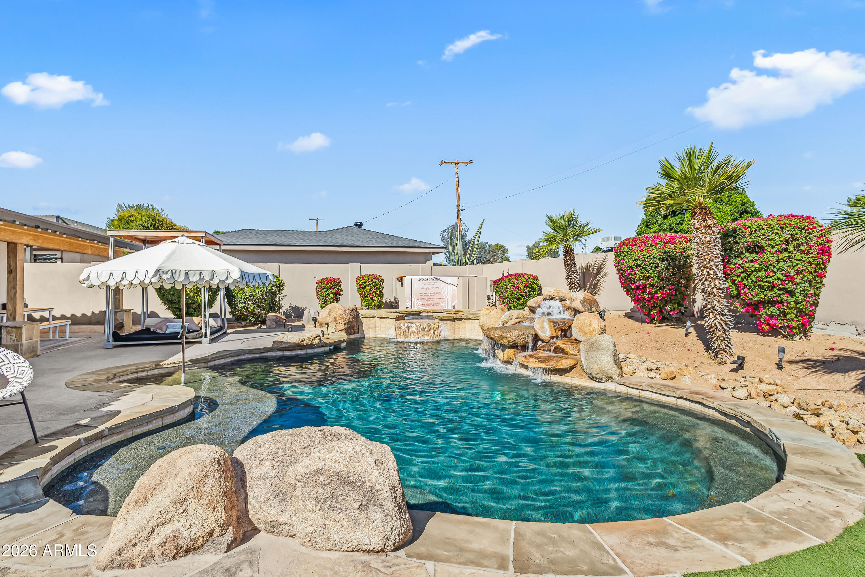 6810 East Granada Road Scottsdale, AZ 85257 - Photo 31 of 34 a swimming pool view with a seating space
