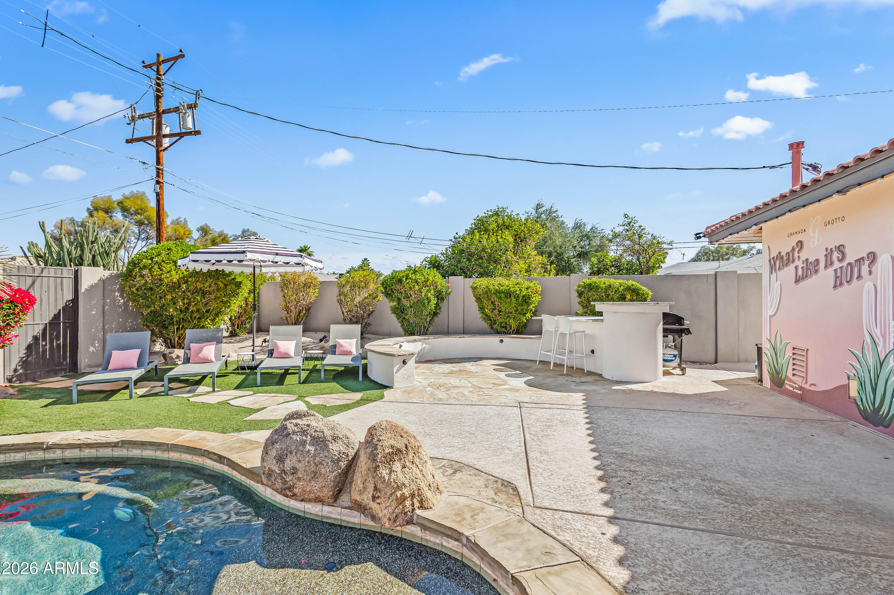 6810 East Granada Road Scottsdale, AZ 85257 - Photo 32 of 34 a front view of a house with garden