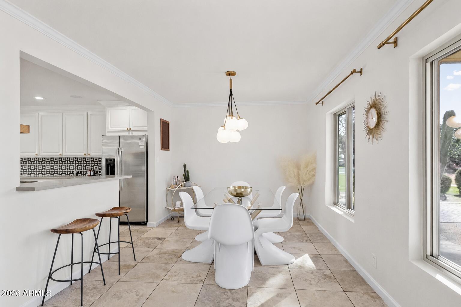 6810 East Granada Road Scottsdale, AZ 85257 - Photo 6 of 34 a dining room with furniture and window