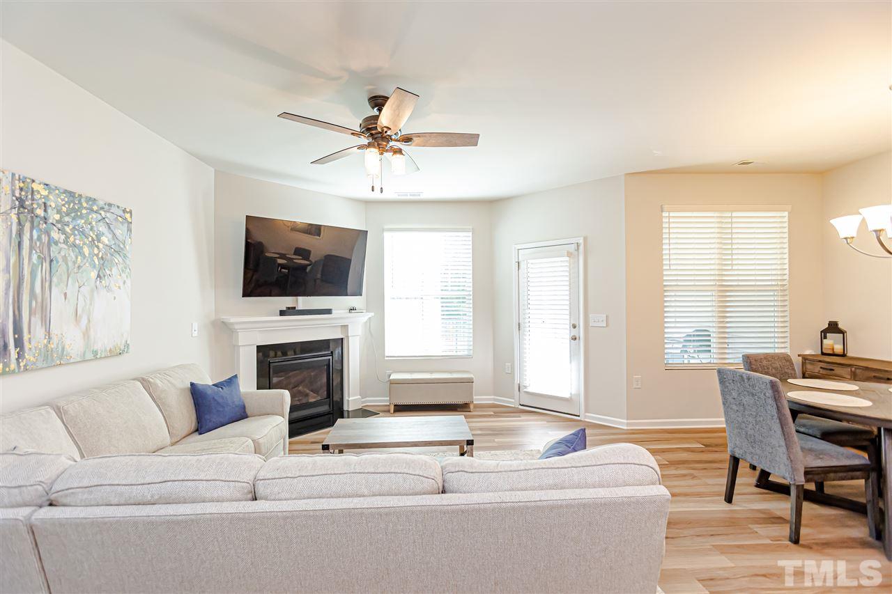 6123 Beale Loop Raleigh, NC 27616 - Photo 12 of 30 a living room with furniture fireplace and flat screen tv