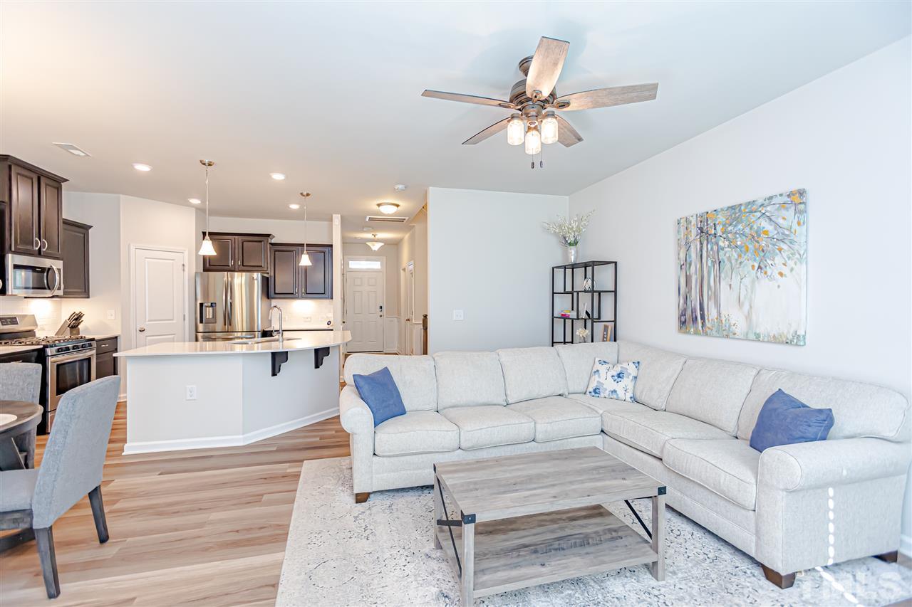 6123 Beale Loop Raleigh, NC 27616 - Photo 13 of 30 a living room with furniture and kitchen view